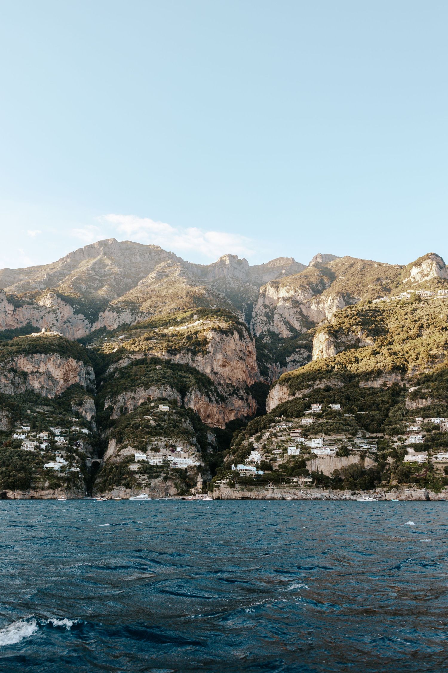 view of positano, italy from a boat along the amalfi coast from an italy elopement photographer