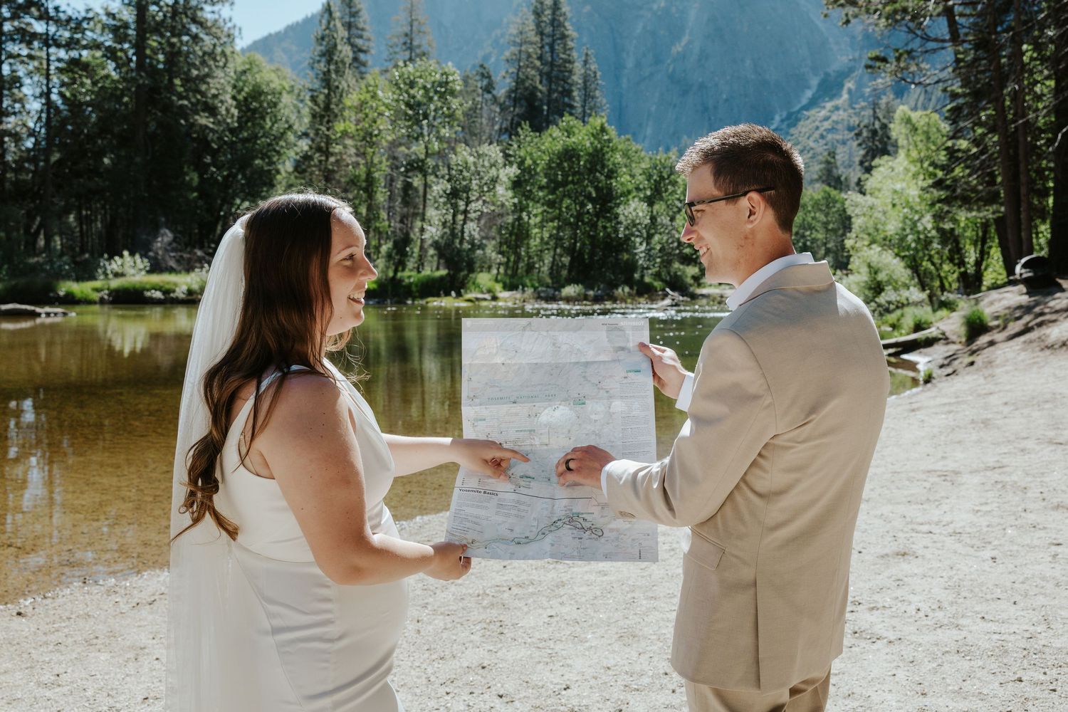 romantic and authentic yosemite national park elopement photographer. couple with a map of yosemite on elopement day