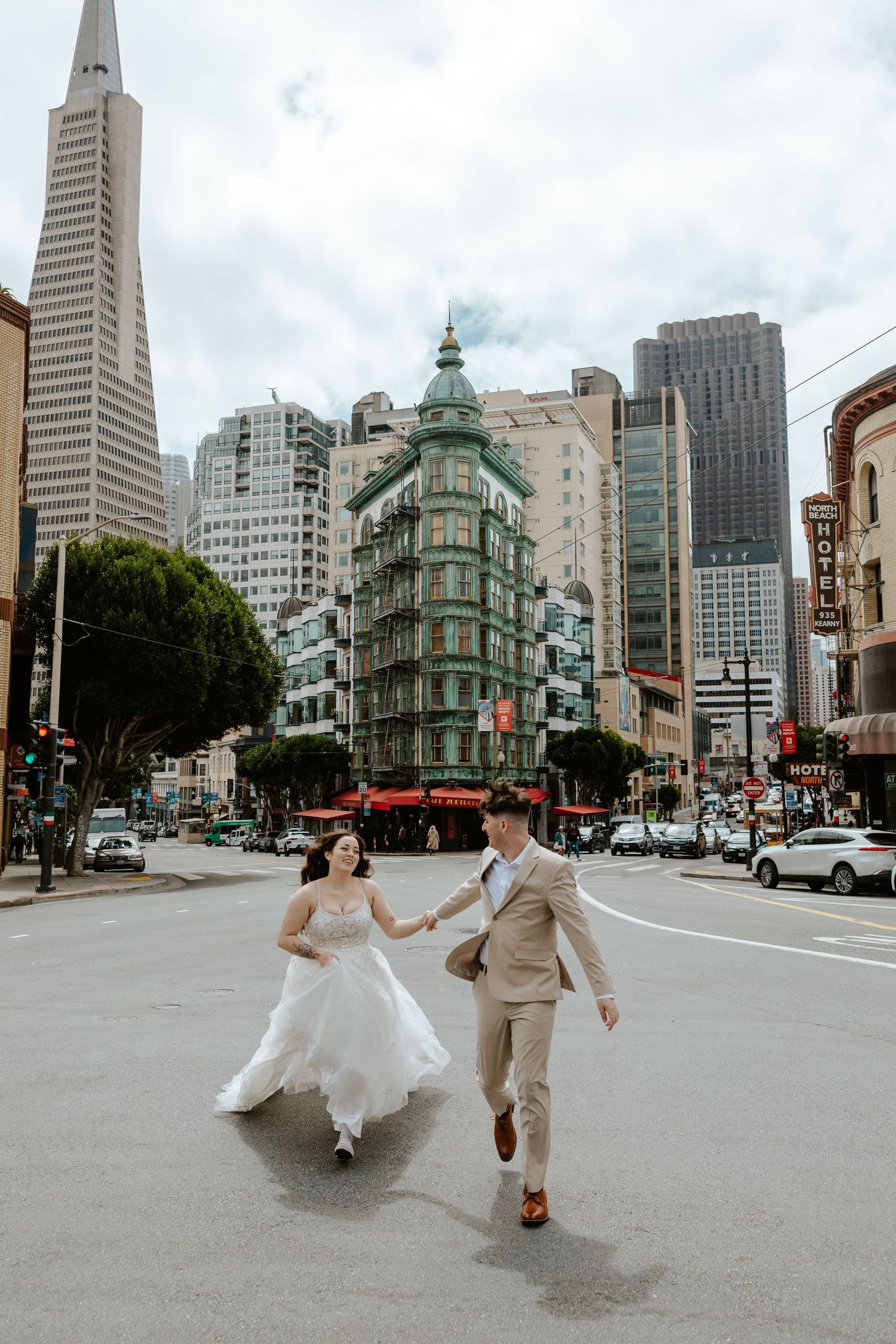 north beach, san francisco elopement photos. couple running in the street. authentic and fun elopement