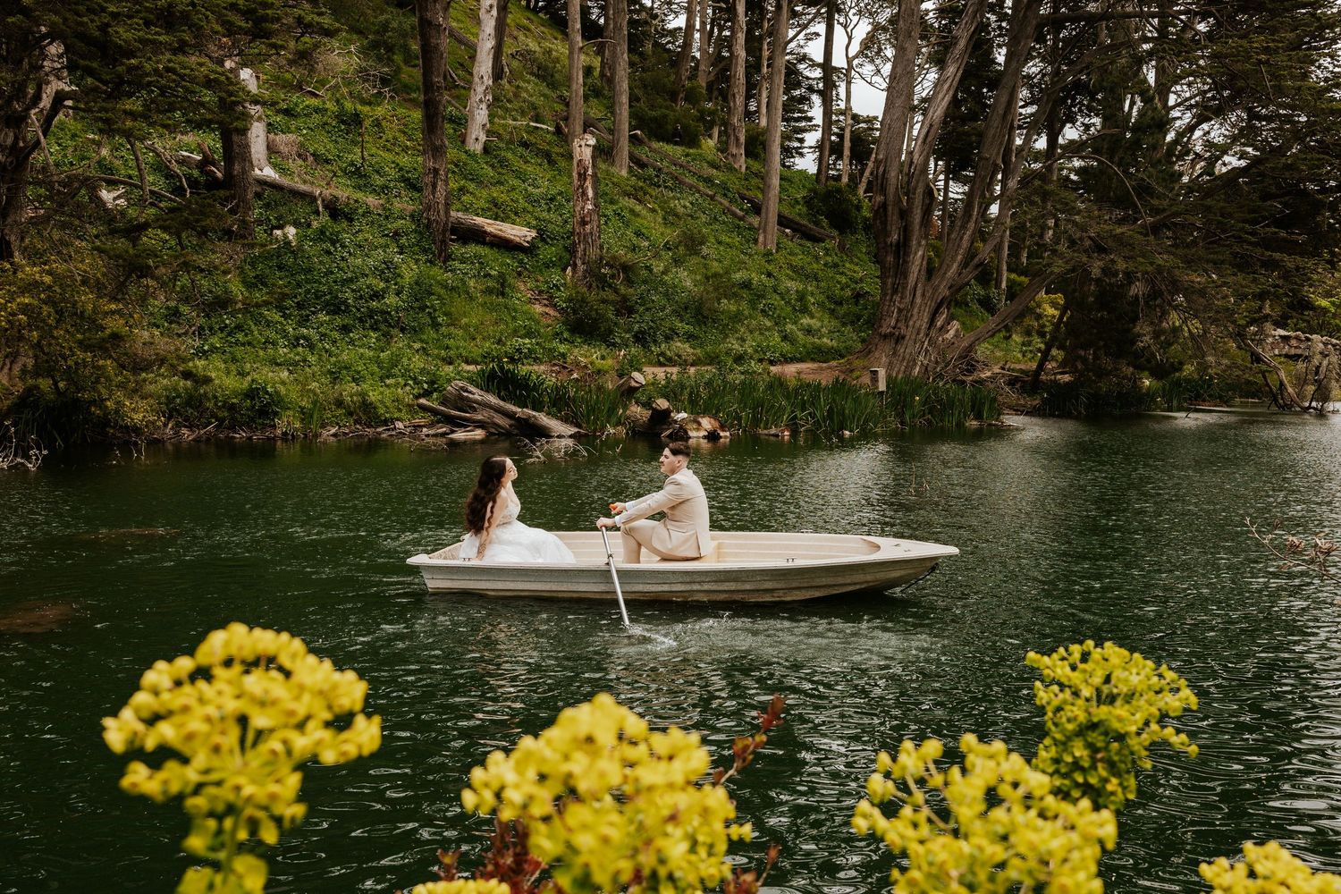 San Francisco elopement - an eloping couple rowing a boat at golden gate park. Authentic and romantic elopement photos