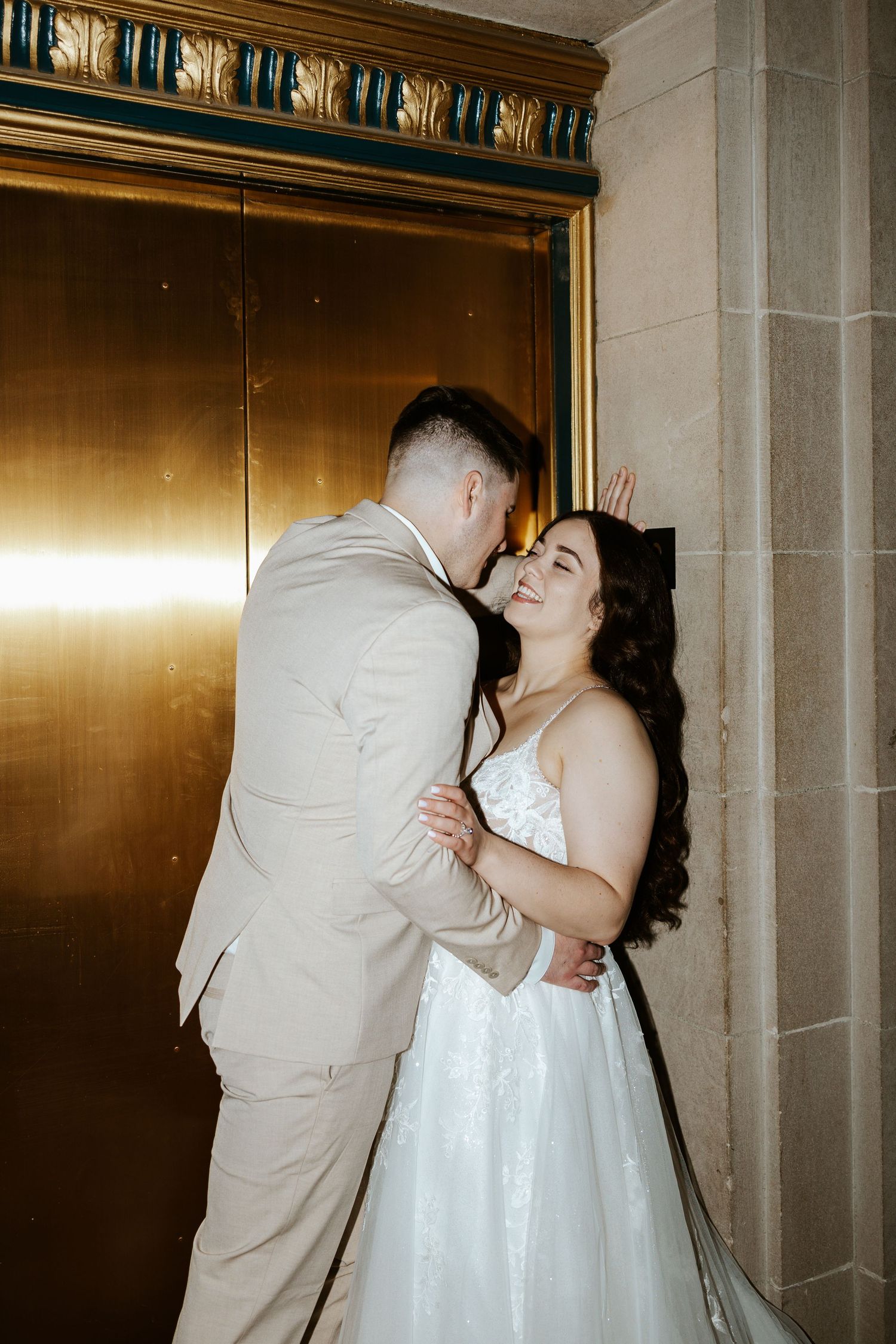 eloping couple kissing near elevator during romantic day in san francisco. bay area elopement photographer