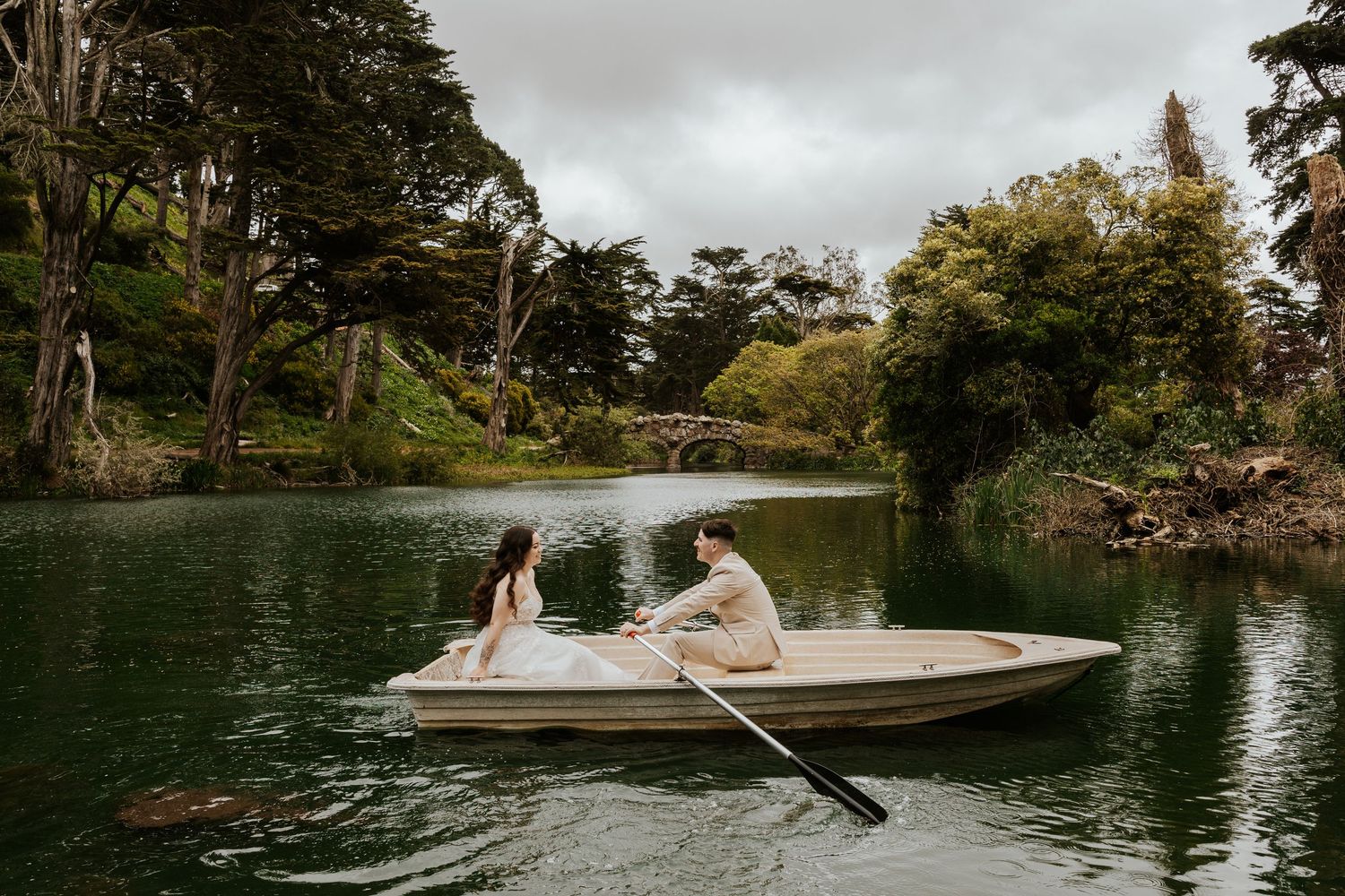 San Francisco elopement - an eloping couple rowing a boat at golden gate park. Authentic and romantic elopement photos