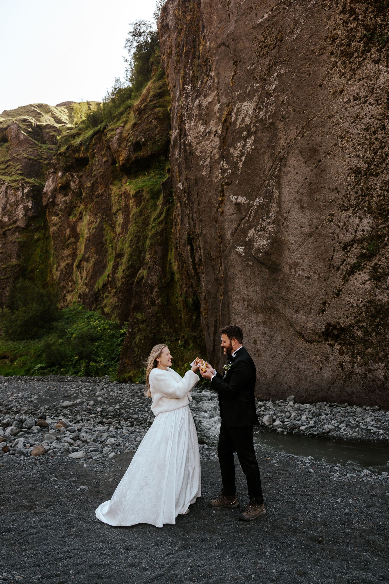 bride and groom cheers-ing their hot dogs in Þórsmörk (Thórsmörk) Iceland
