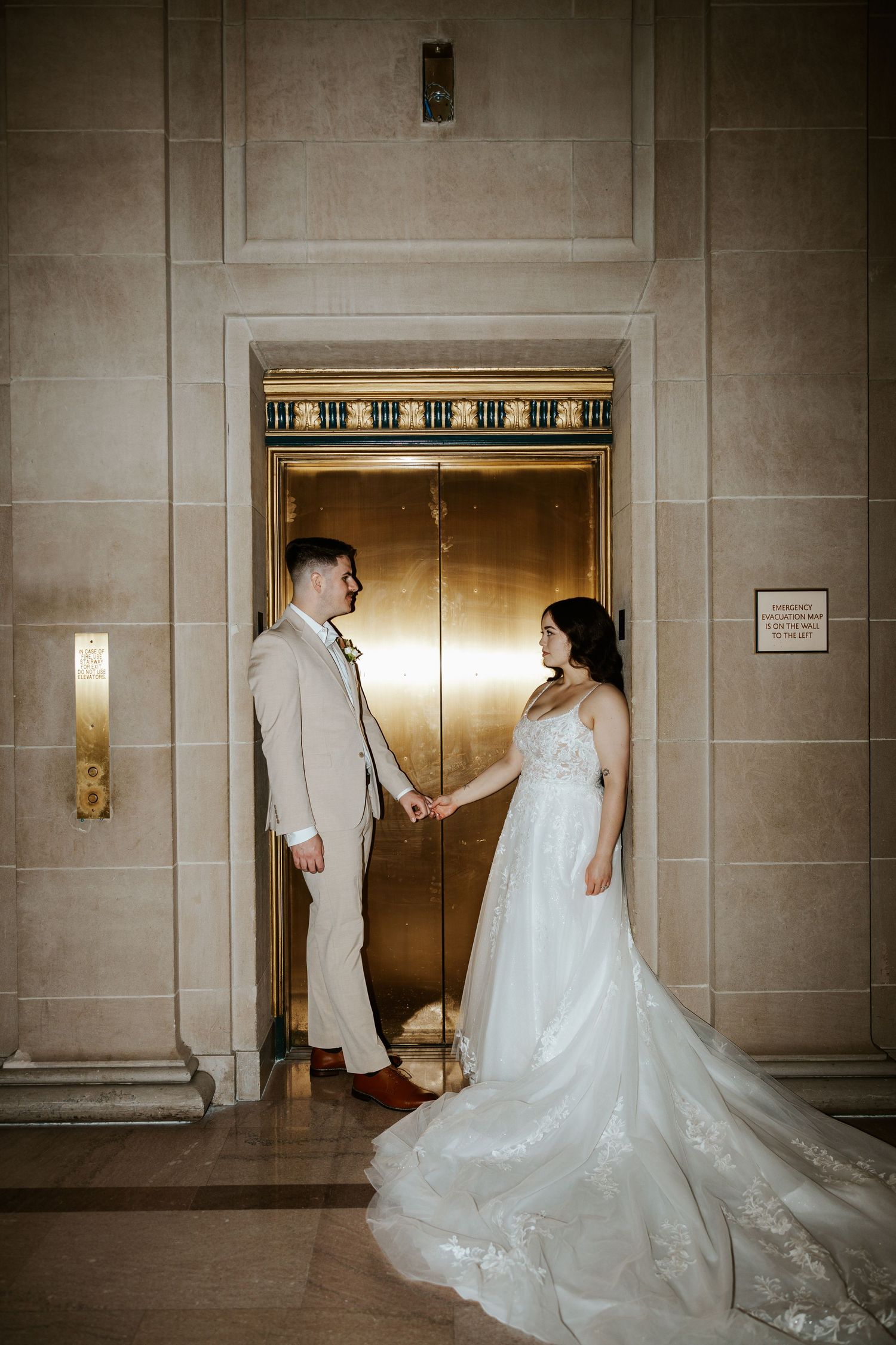 eloping couple near elevator during romantic day in san francisco. bay area elopement photographer