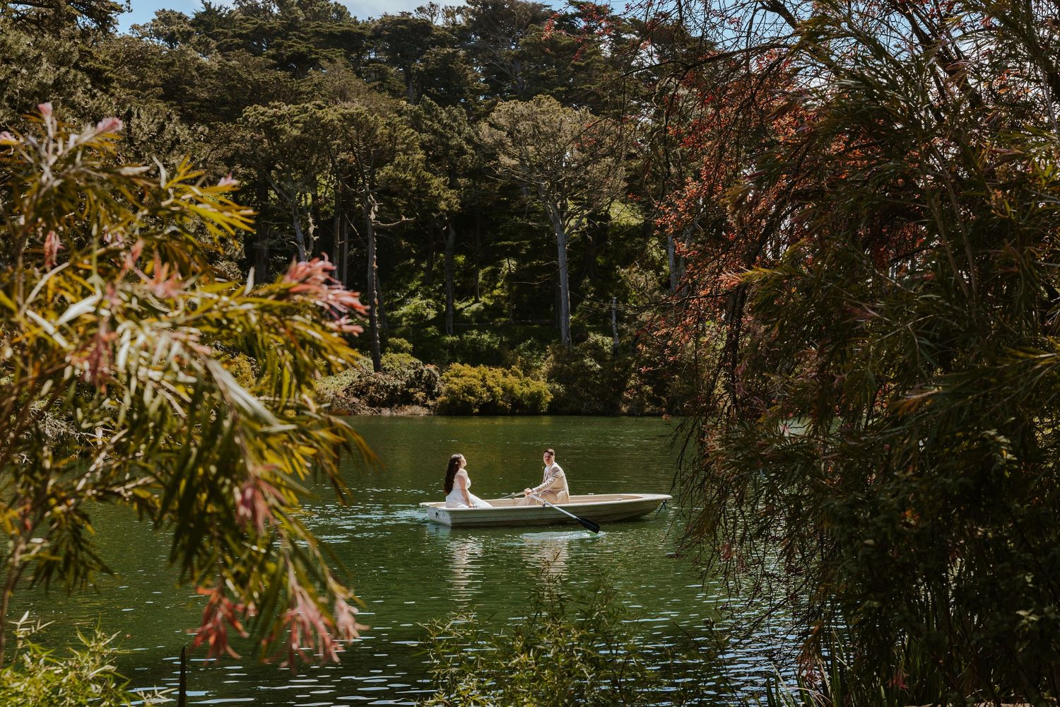 San Francisco elopement - an eloping couple rowing a boat at golden gate park. Authentic and romantic elopement photos