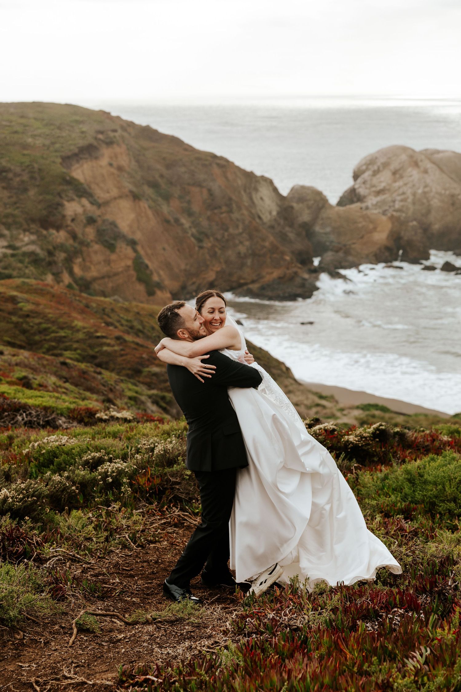 candid san francisco elopement couple on the cliffs in marin headlands