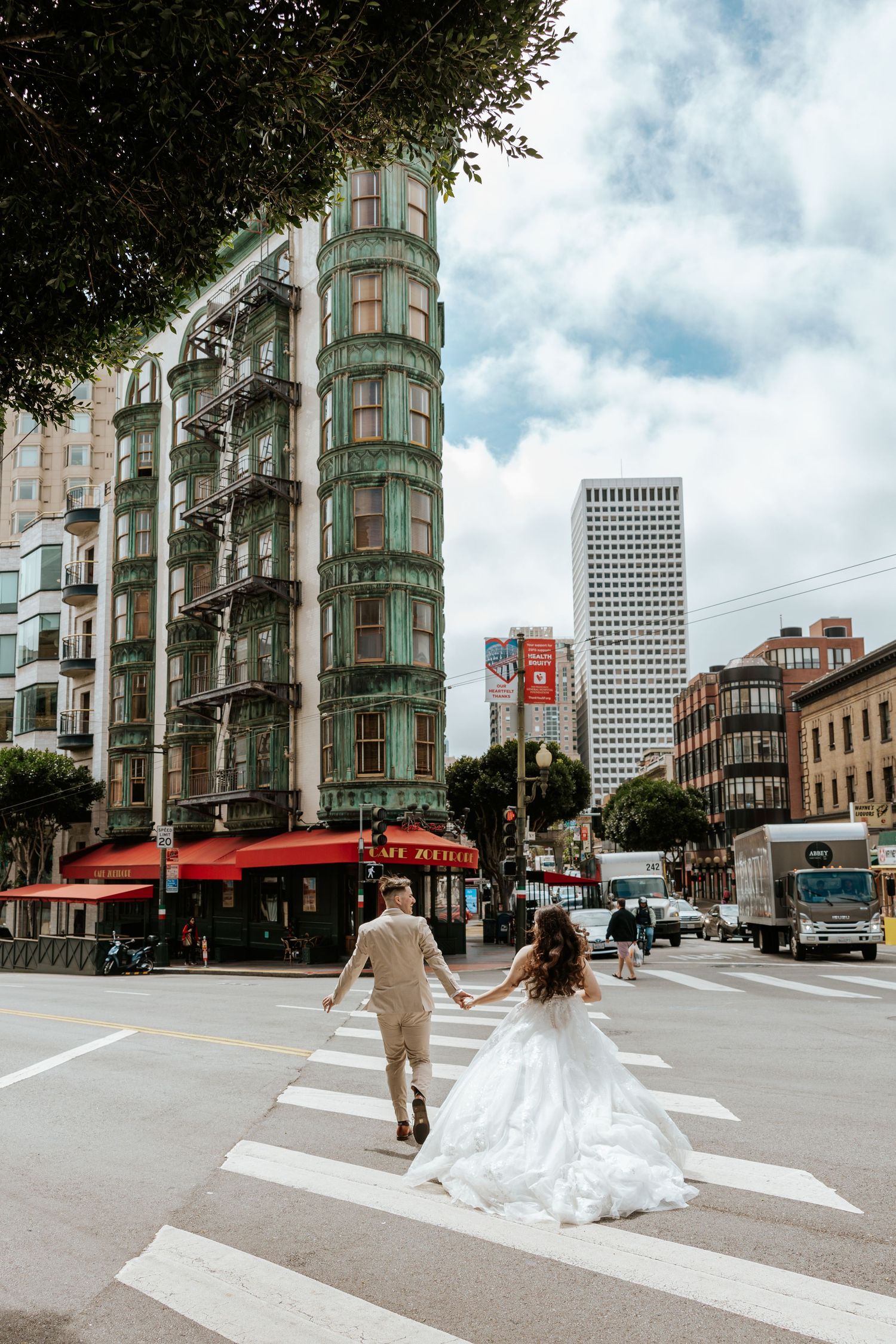 north beach, san francisco elopement photos. couple running in the street. authentic and fun elopement