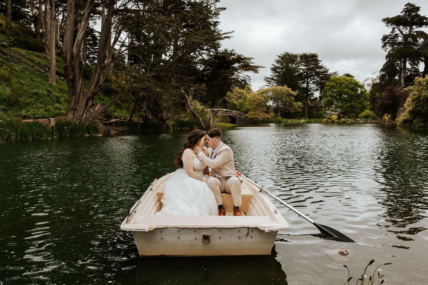 San Francisco elopement - an eloping couple rowing a boat at golden gate park. Authentic and romantic elopement photos