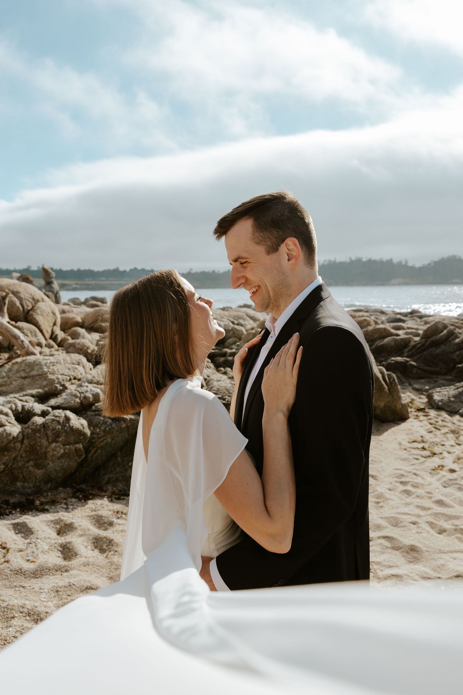 coupl e staring into each other's eyes during beach elopement day