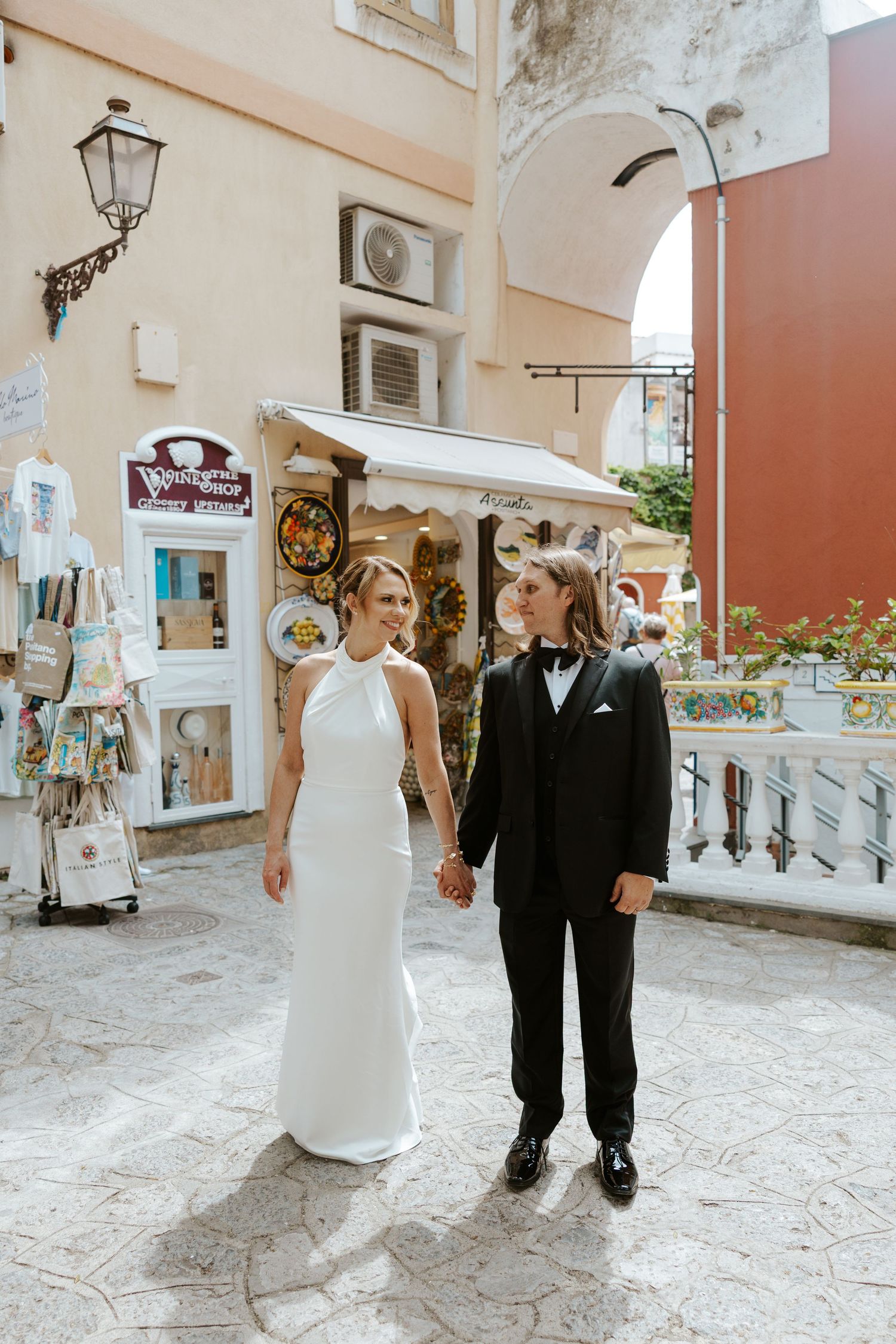 bride and groom walking around the streets of Positano during Italy elopement day