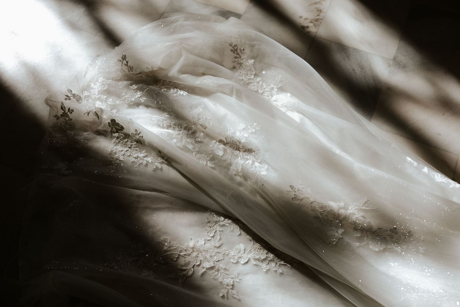 creative detail photo with light and shadows on bride's dress during elopement day in san francisco