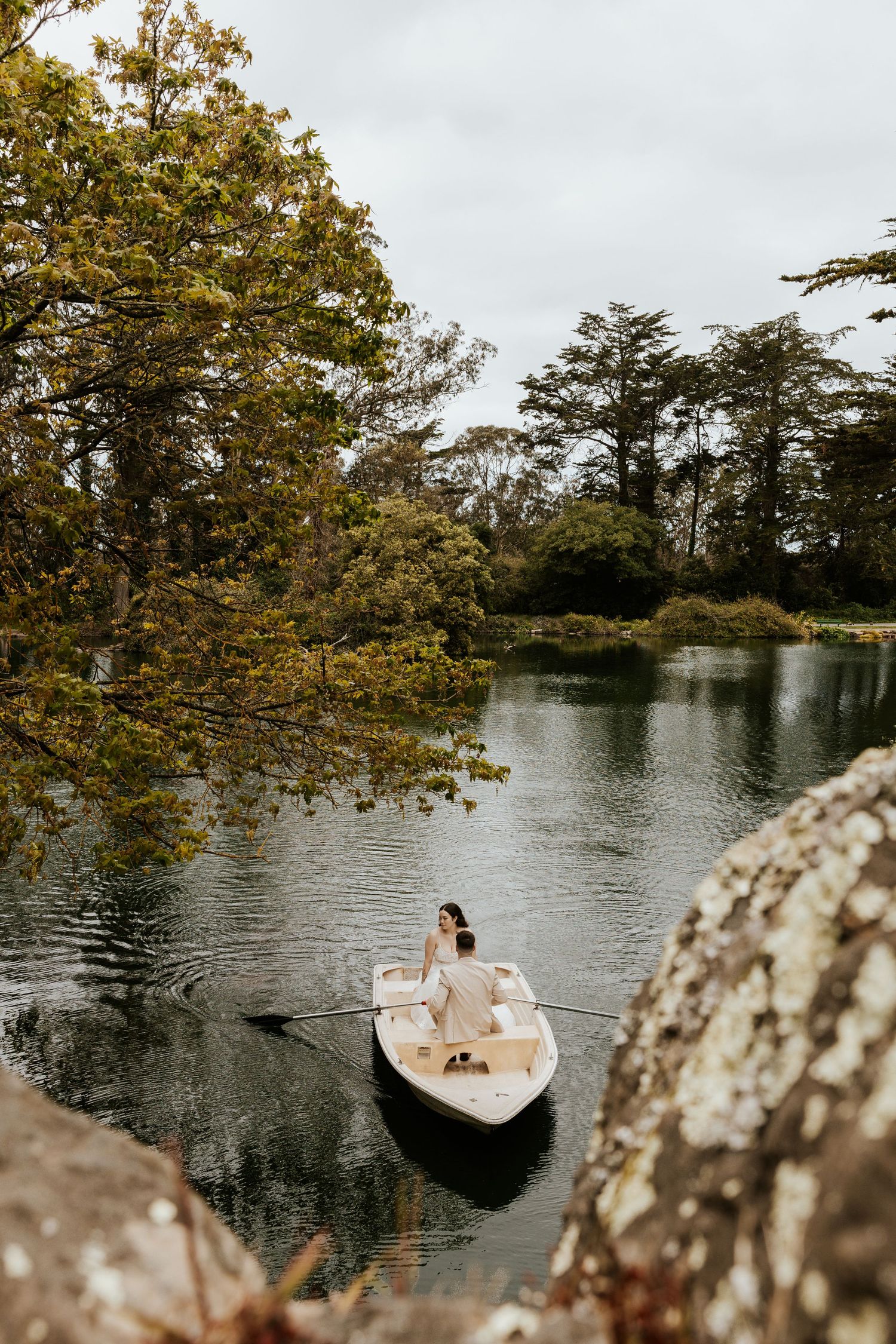 San Francisco elopement - an eloping couple rowing a boat at golden gate park