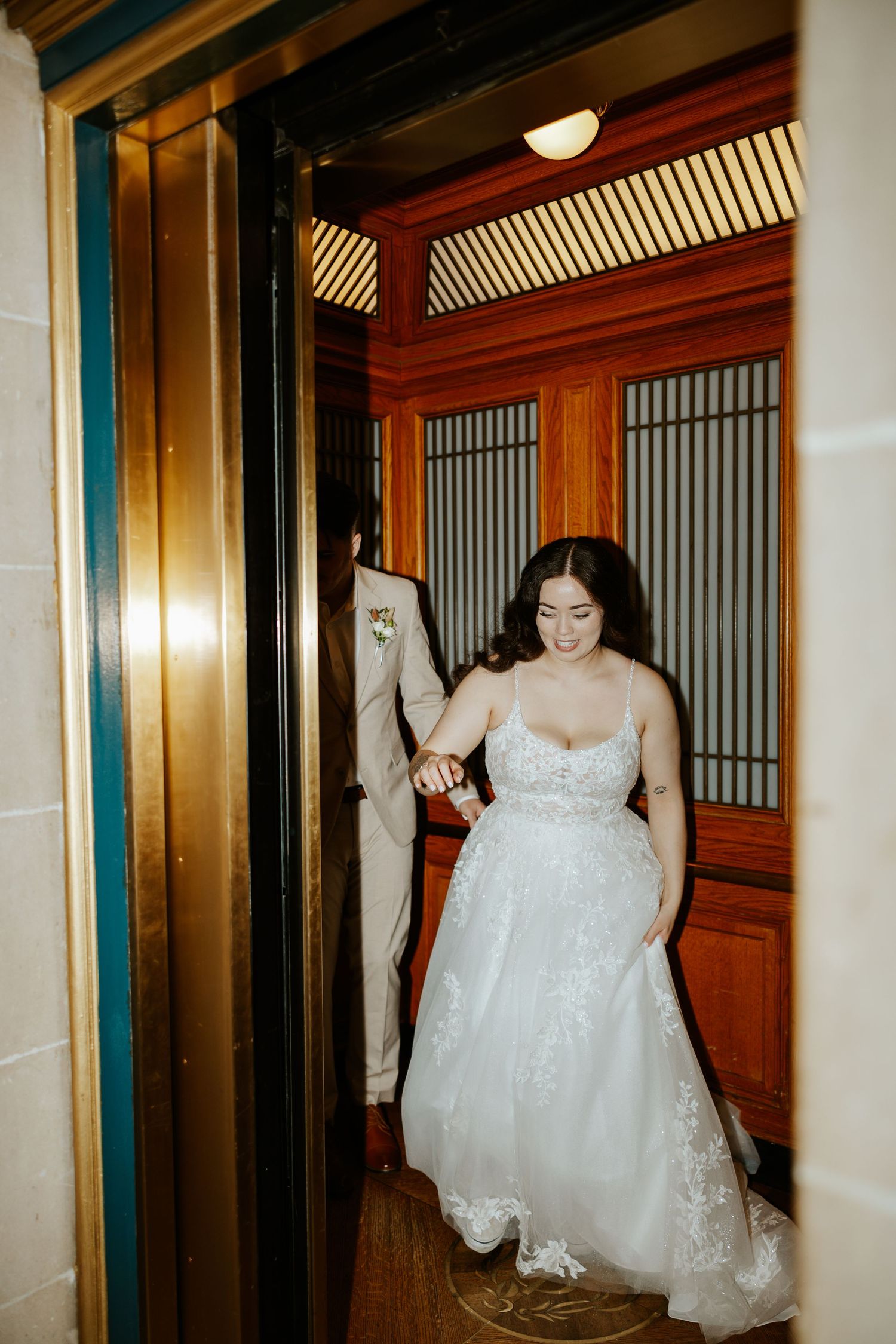 eloping couple running out of elevator in san francisco. bay area elopement photographer