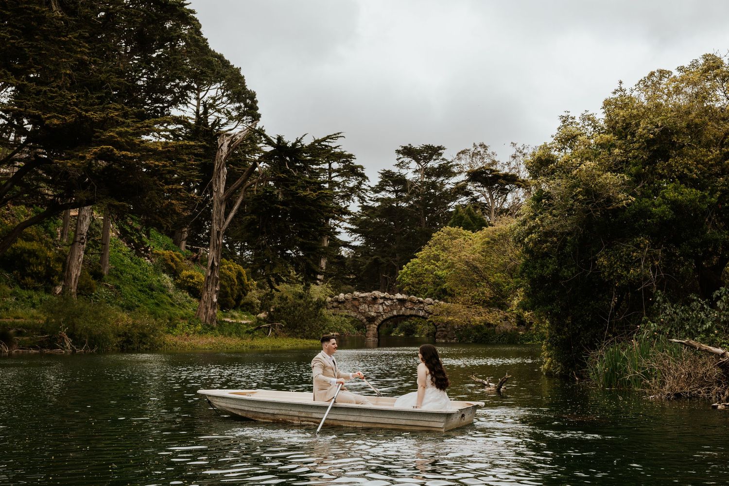San Francisco elopement - an eloping couple rowing a boat at golden gate park. Authentic and romantic elopement photos
