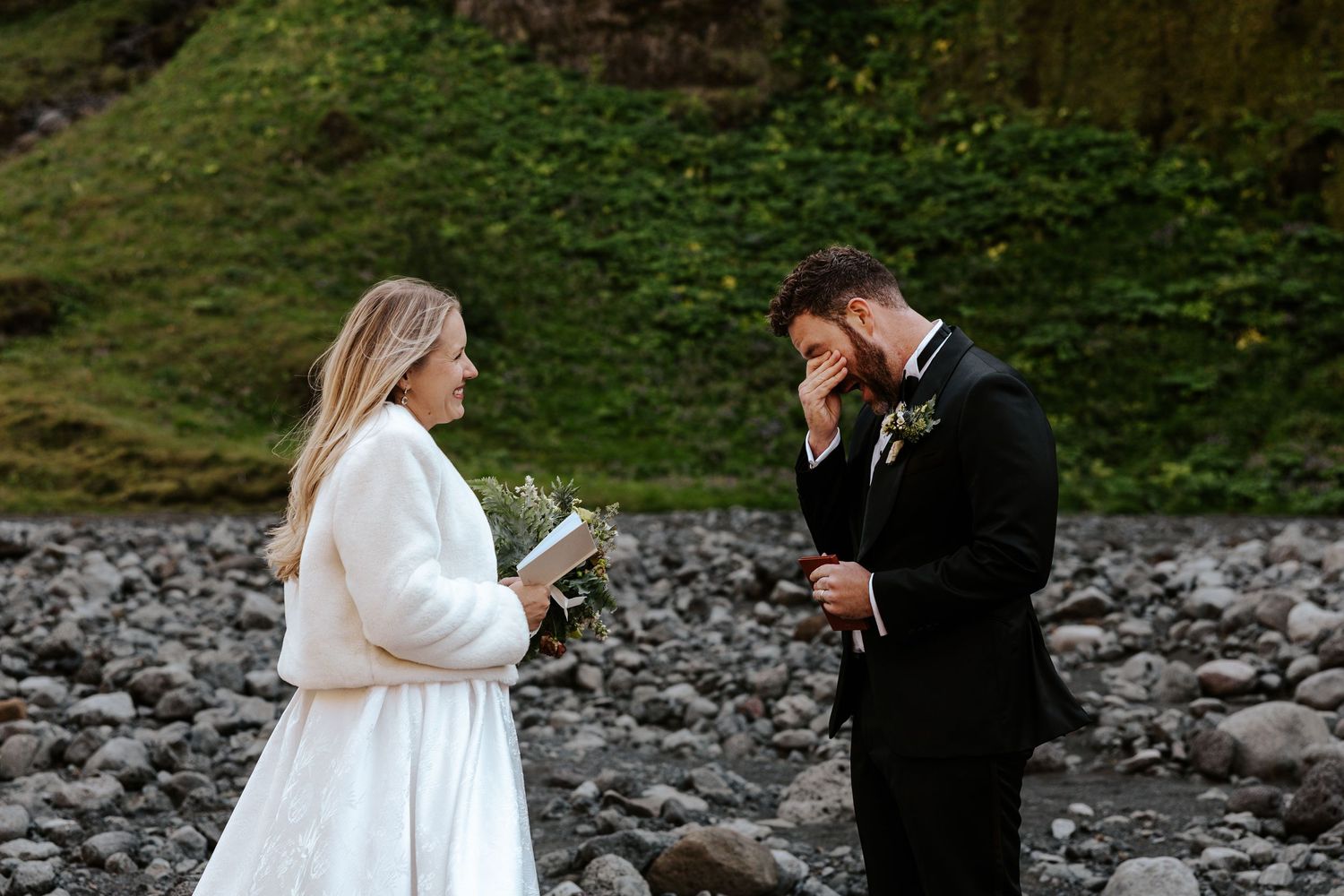 groom crying while bride shares her vows during iceland elopement
