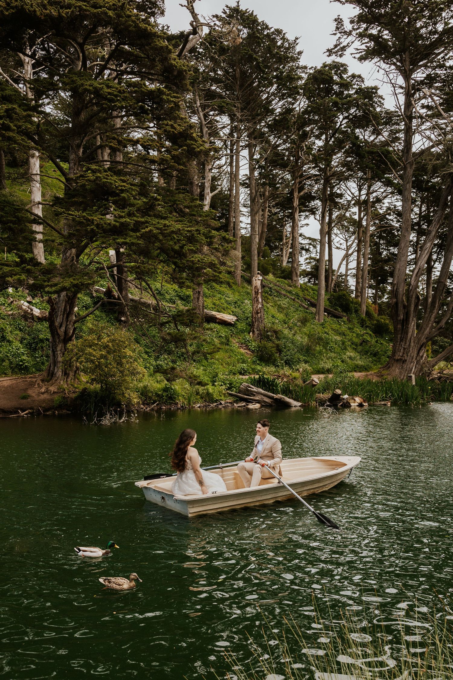 san francisco bay area elopement photographer captures authentic and romantic elopement photos in golden gate park while couple is in a boat