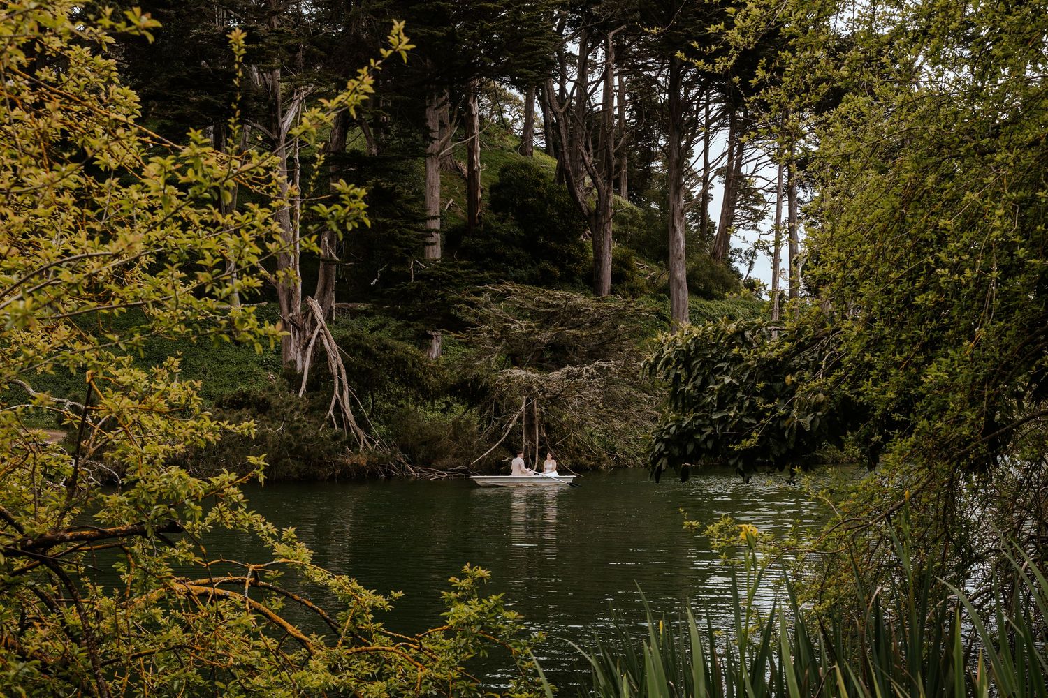 San Francisco elopement - a couple is on a romantic row boat in golden gate park
