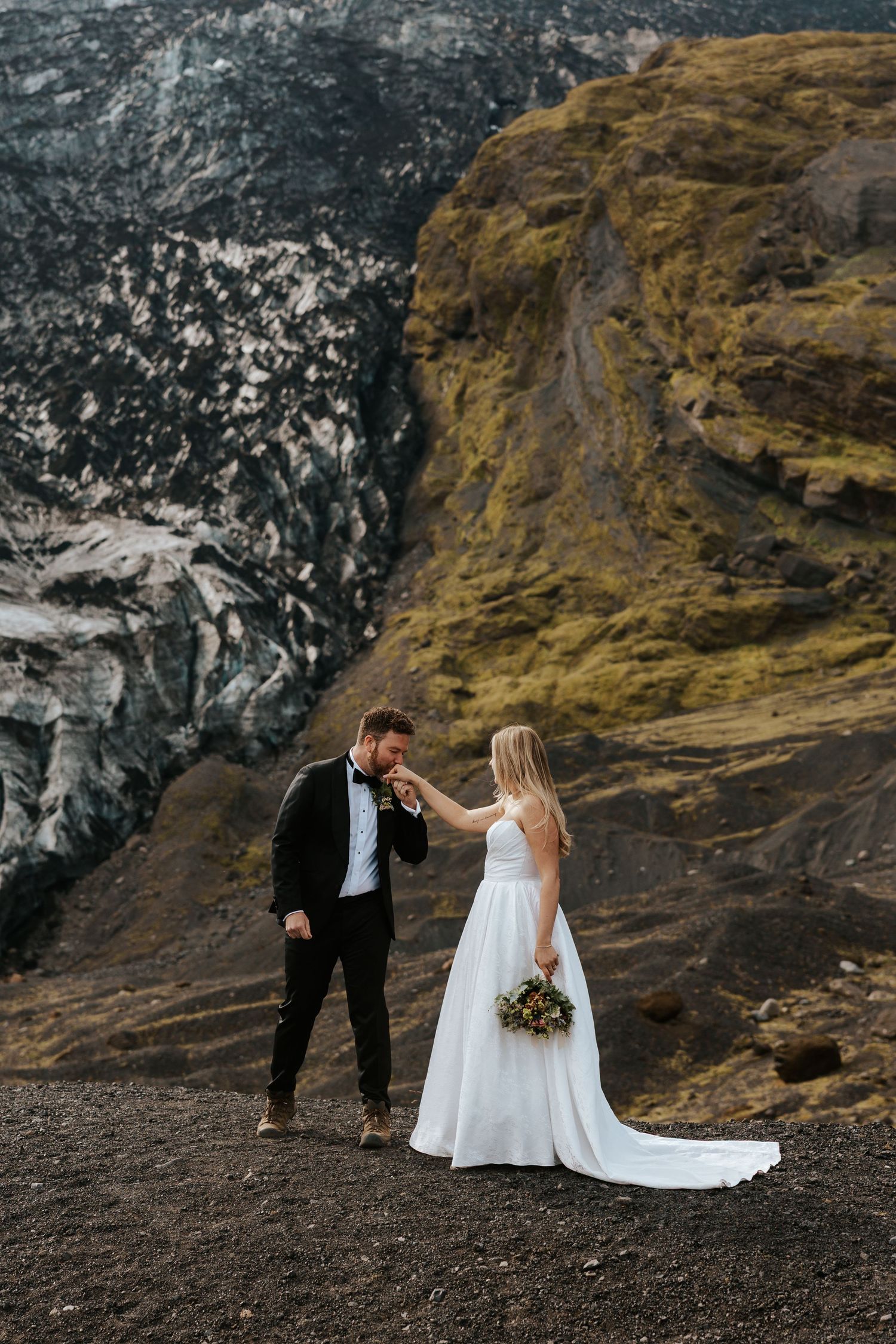candid of groom kissing bride's hand during Iceland elopement day in Þórsmörk (Thórsmörk), Iceland