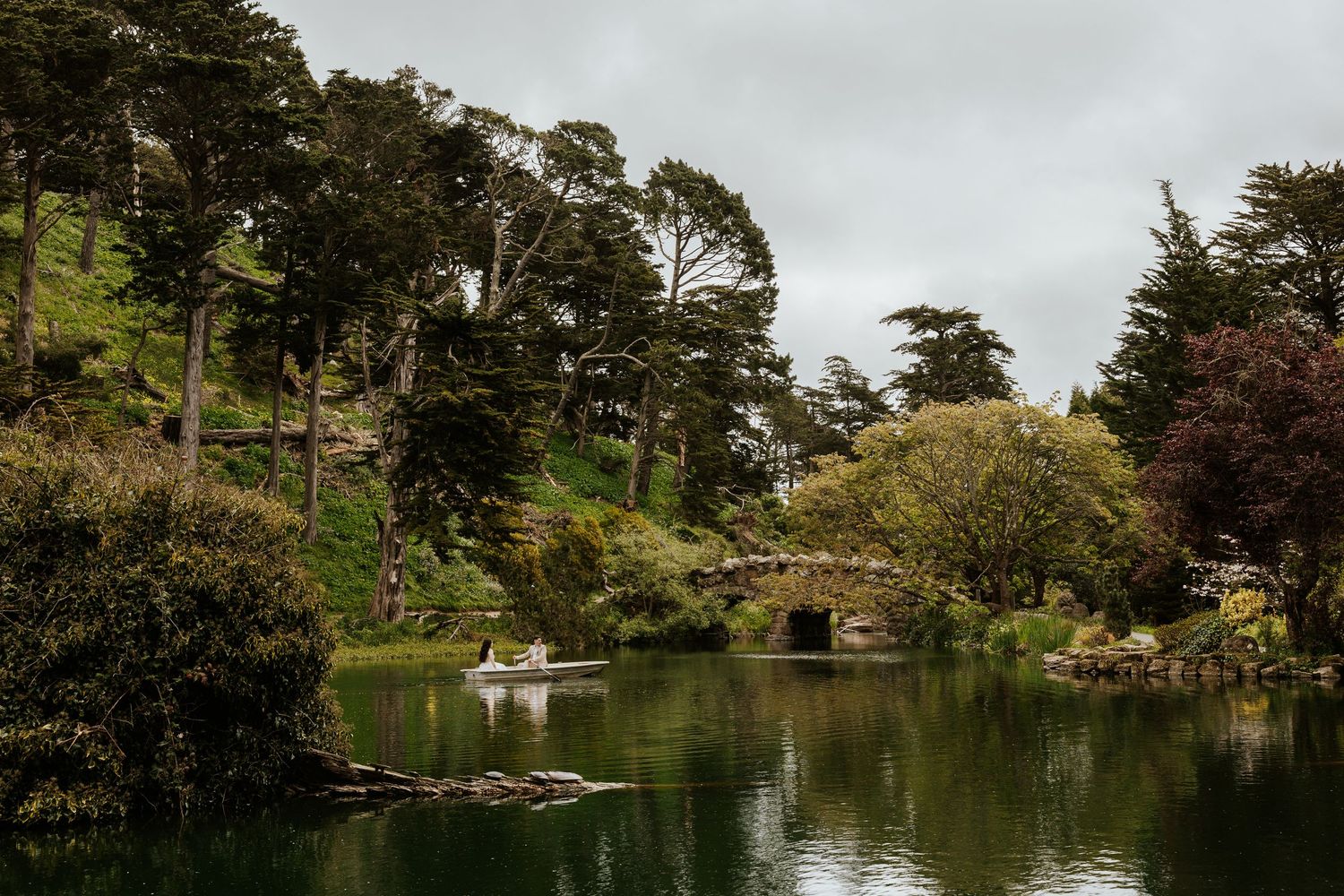 San Francisco elopement - an eloping couple rowing a boat at golden gate park