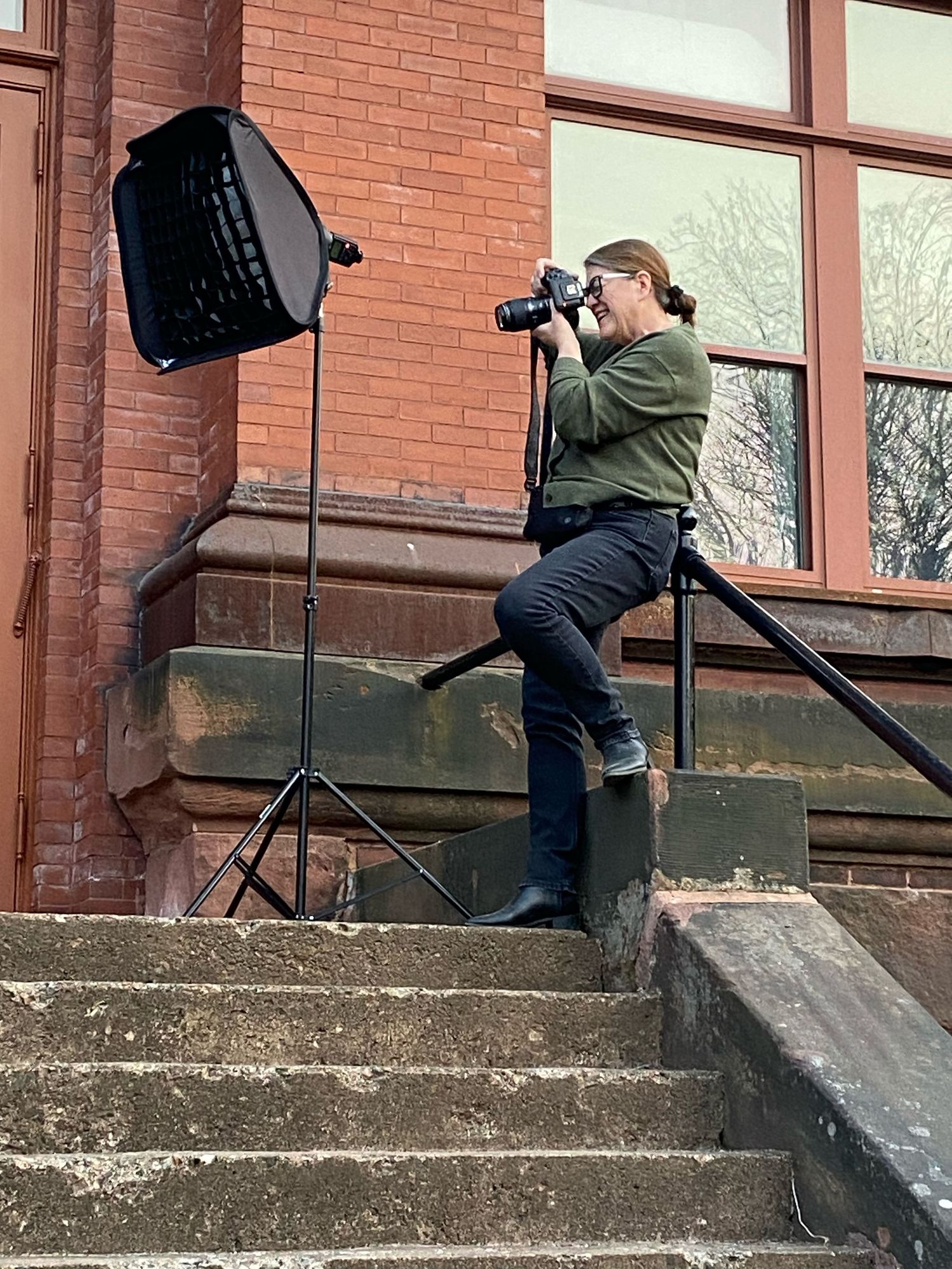 Image of the photographer taking photos on steps of the Colchester Historium Museum.