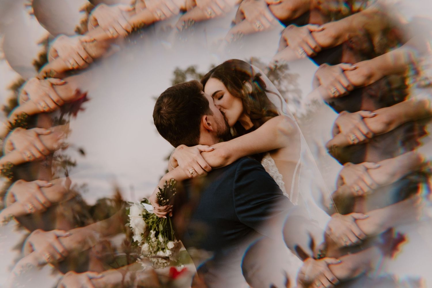 An artistic overhead shot shows a couple in wedding attire surrounded by guests forming a circle.