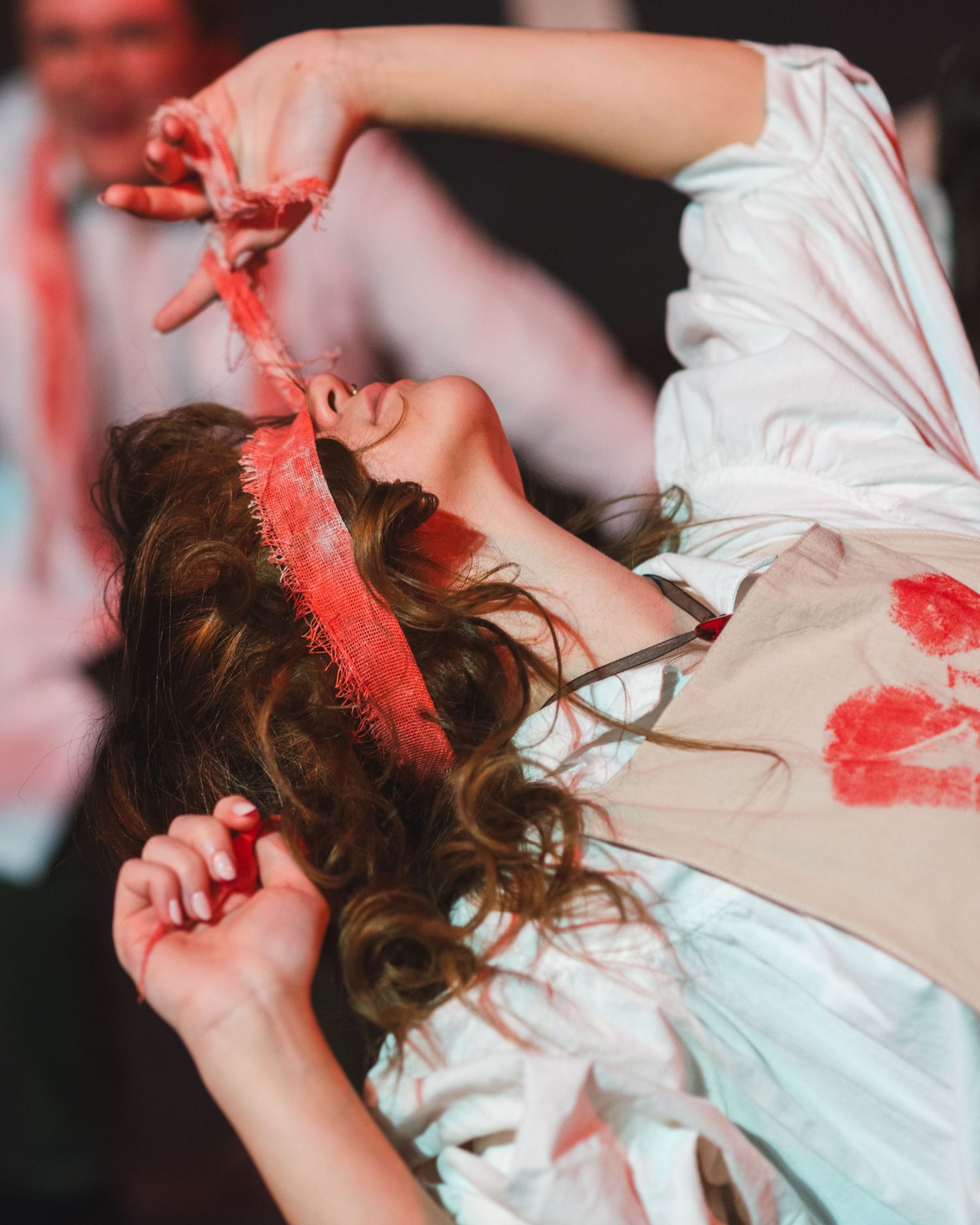 A photo from a production of Alice by Heart. The actress playing the Queen of Hearts is featured.