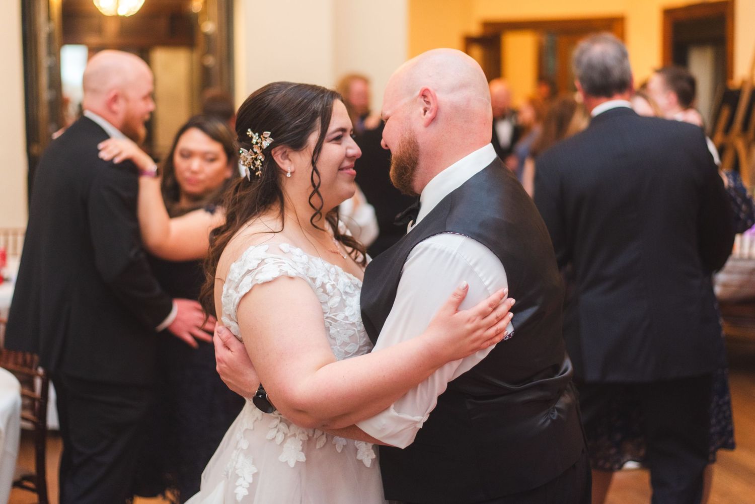A newlywed couple having their first dance.