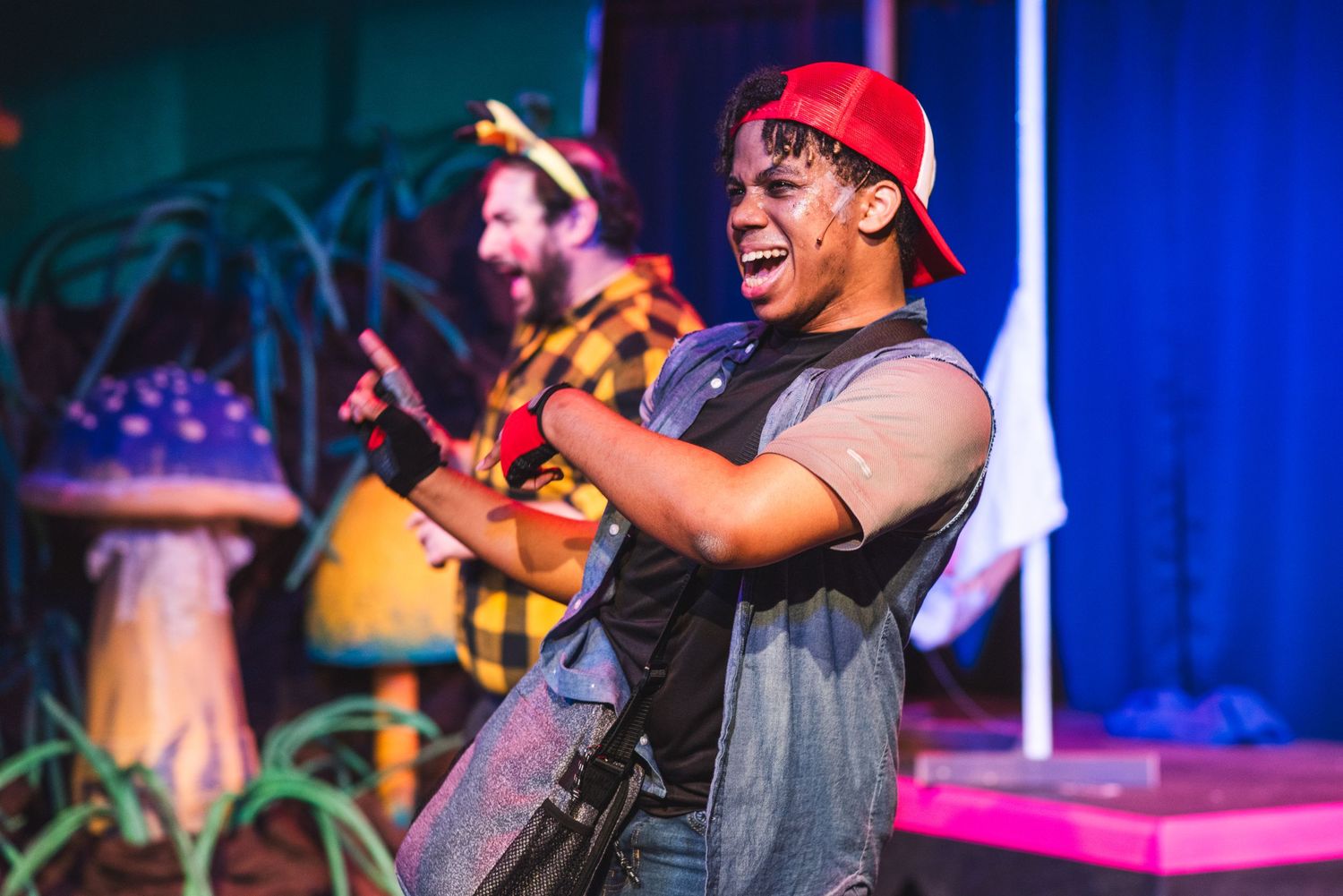 A photo from a production of Pocketmon. The actors playing not-Ash and not-Pikachu are featured.