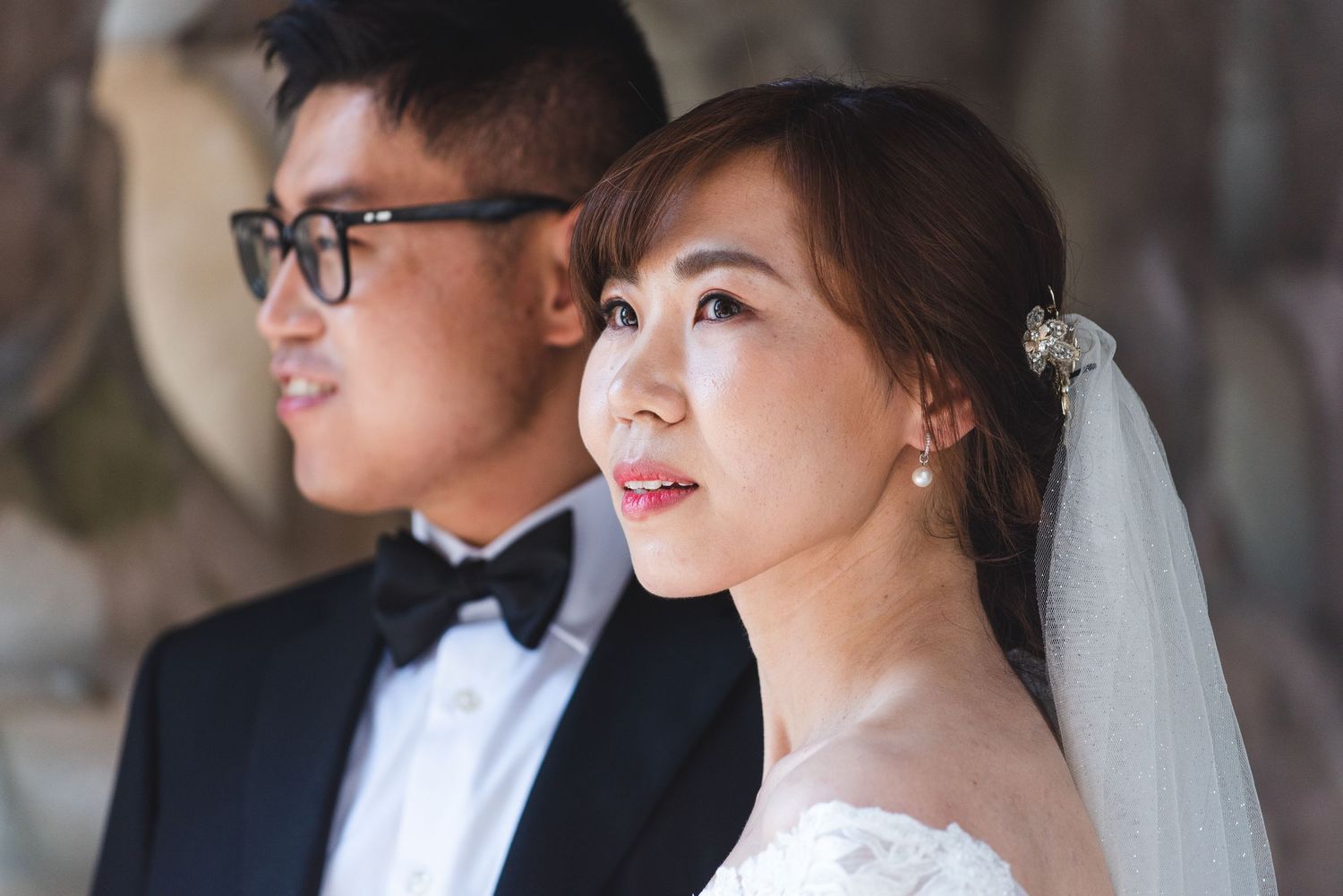 A bride and groom before their ceremony. The bride looks...thoughtful.
