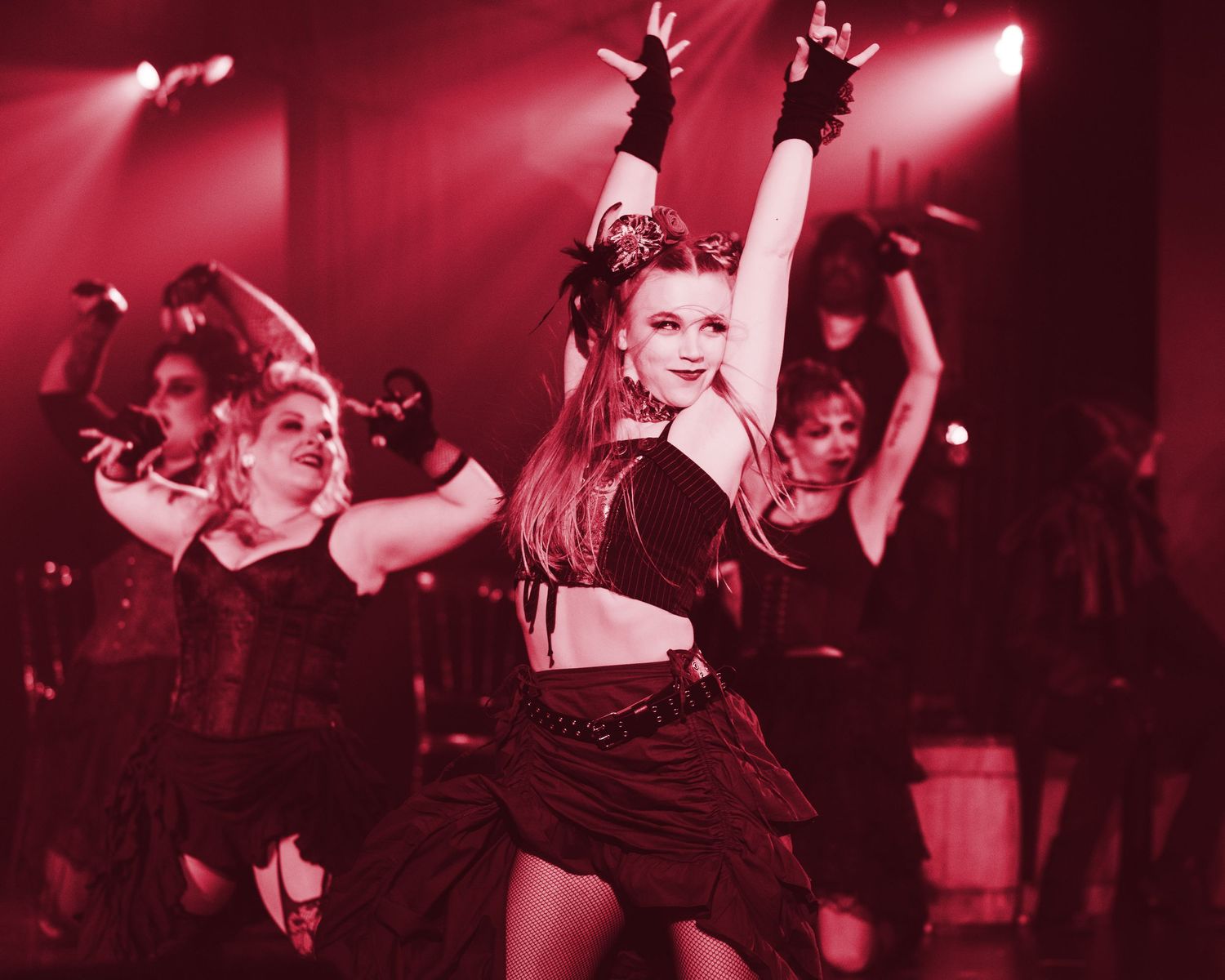 A photo from a production of Jekyll and Hyde. Katelyn is featured, along with some other dancers.