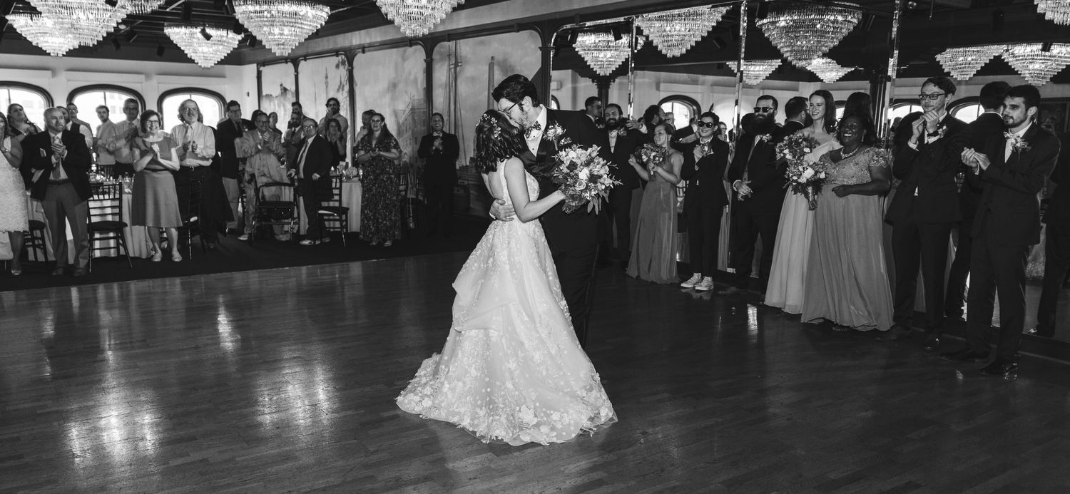 A newlywed couple having their first dance.