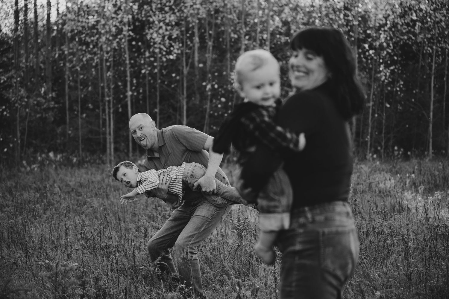 A series of vintage black and white photographs showing children playing outdoors in a rural setting.
