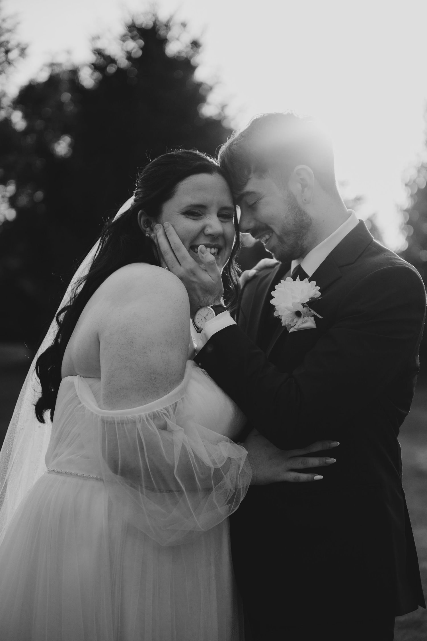 A romantic black and white wedding photo sequence showing a couple sharing their first kiss as newlyweds.
