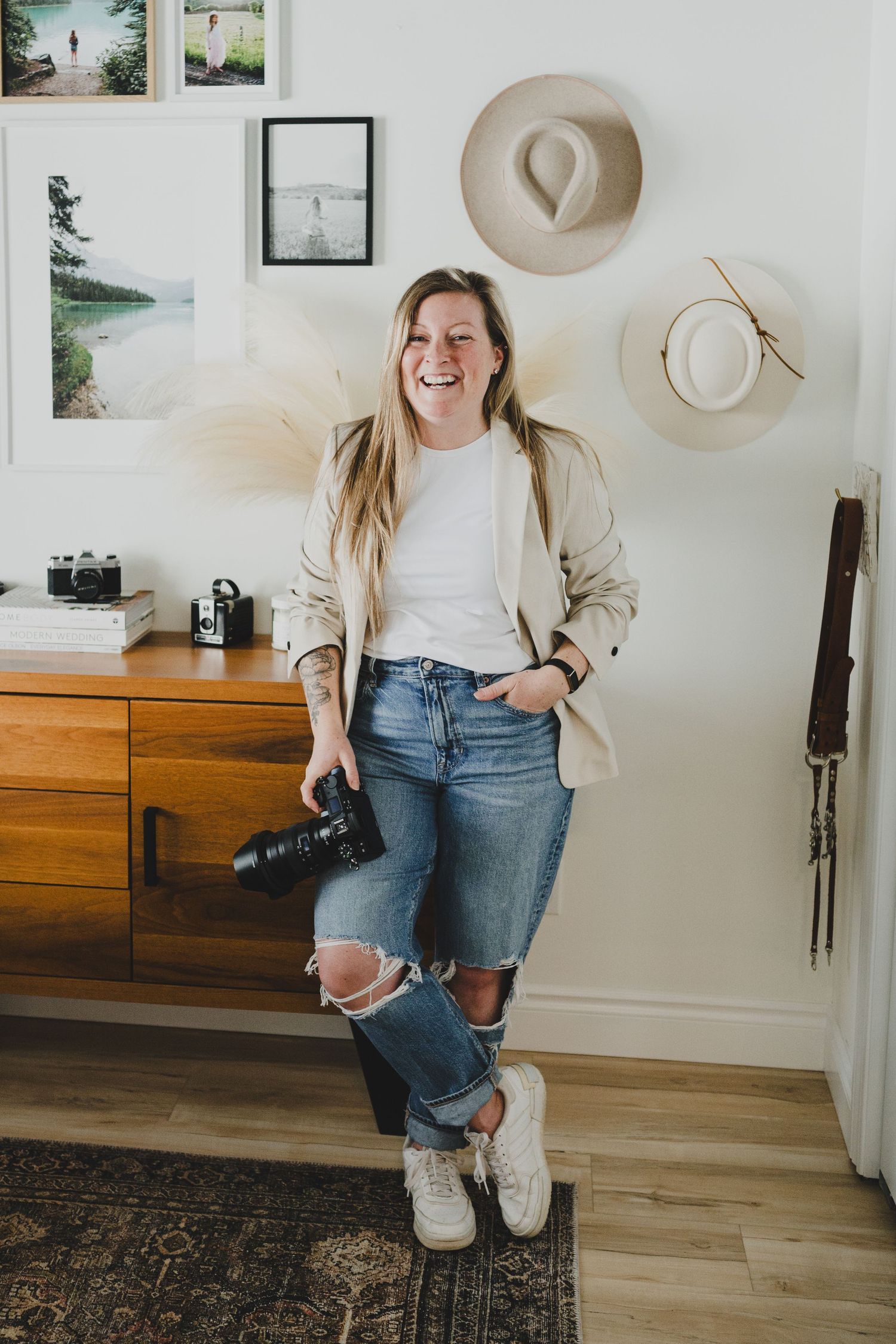 A lifestyle photo series showing a casual outfit with ripped jeans, white sneakers and beige jacket against a neutral wall.
