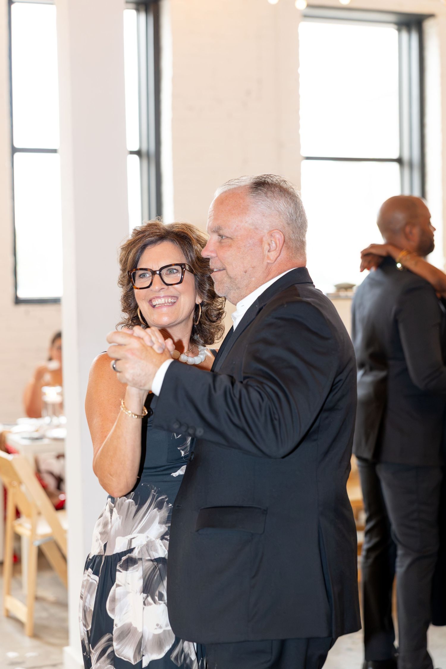 Wedding reception at Flat 51 in downtown Columbus, Ohio, featuring elegant reception details, heartfelt moments, and joyful celebration.