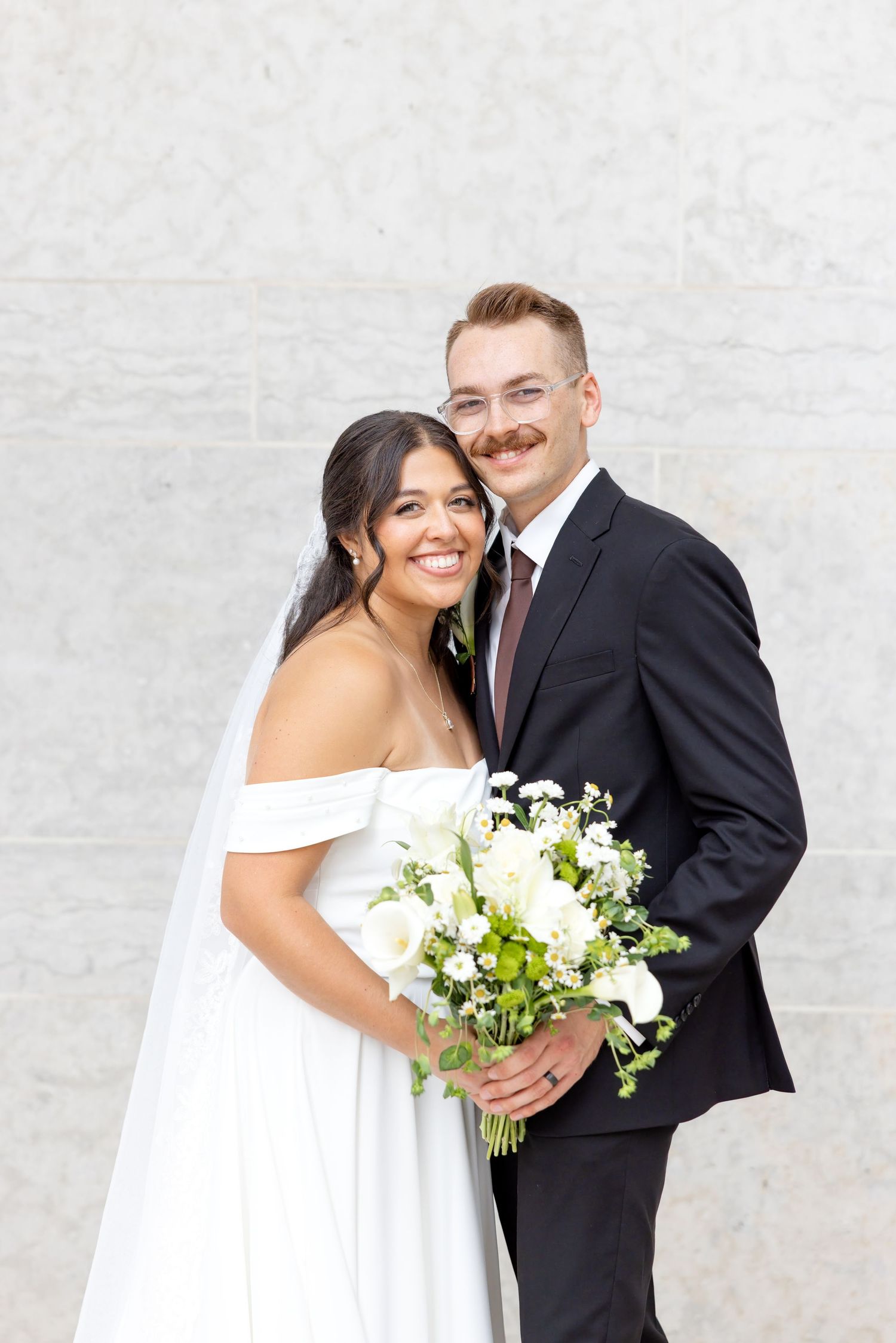 Bride and groom portraits at the Ohio Statehouse in downtown Columbus, Ohio, captured with timeless, light and airy wedding photography.