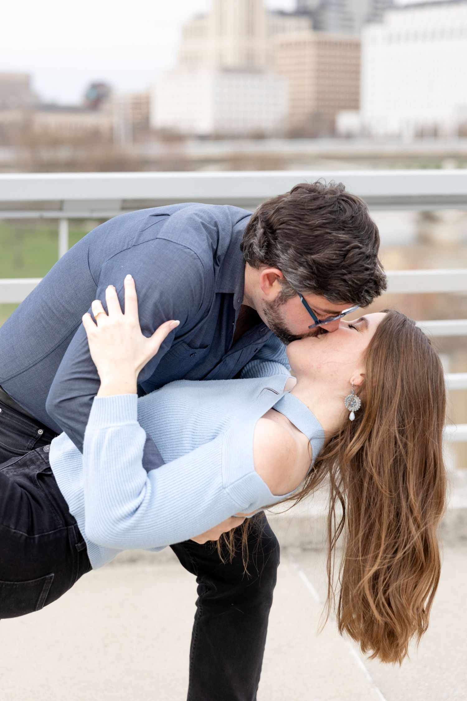 Downtown Columbus engagement photos on Main Street Bridge with a joyful couple in a light and airy style