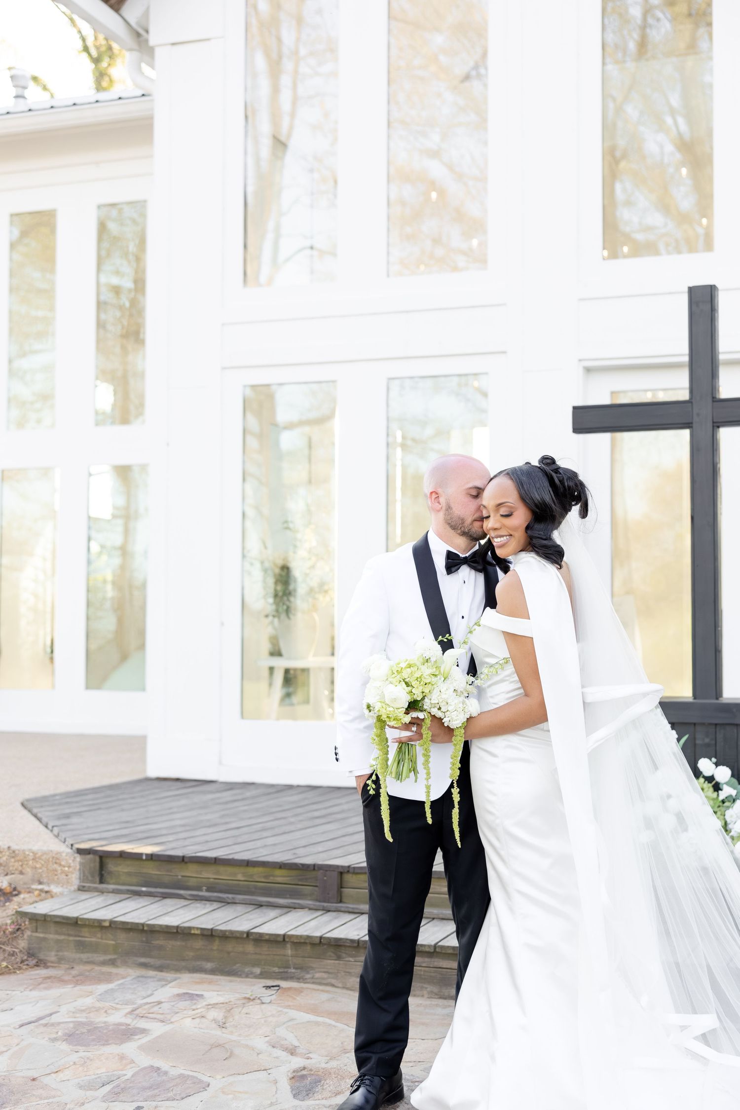 Light and airy wedding photos at The Glass House near Huntsville, Alabama capturing joyful, timeless moments of a bride and groom