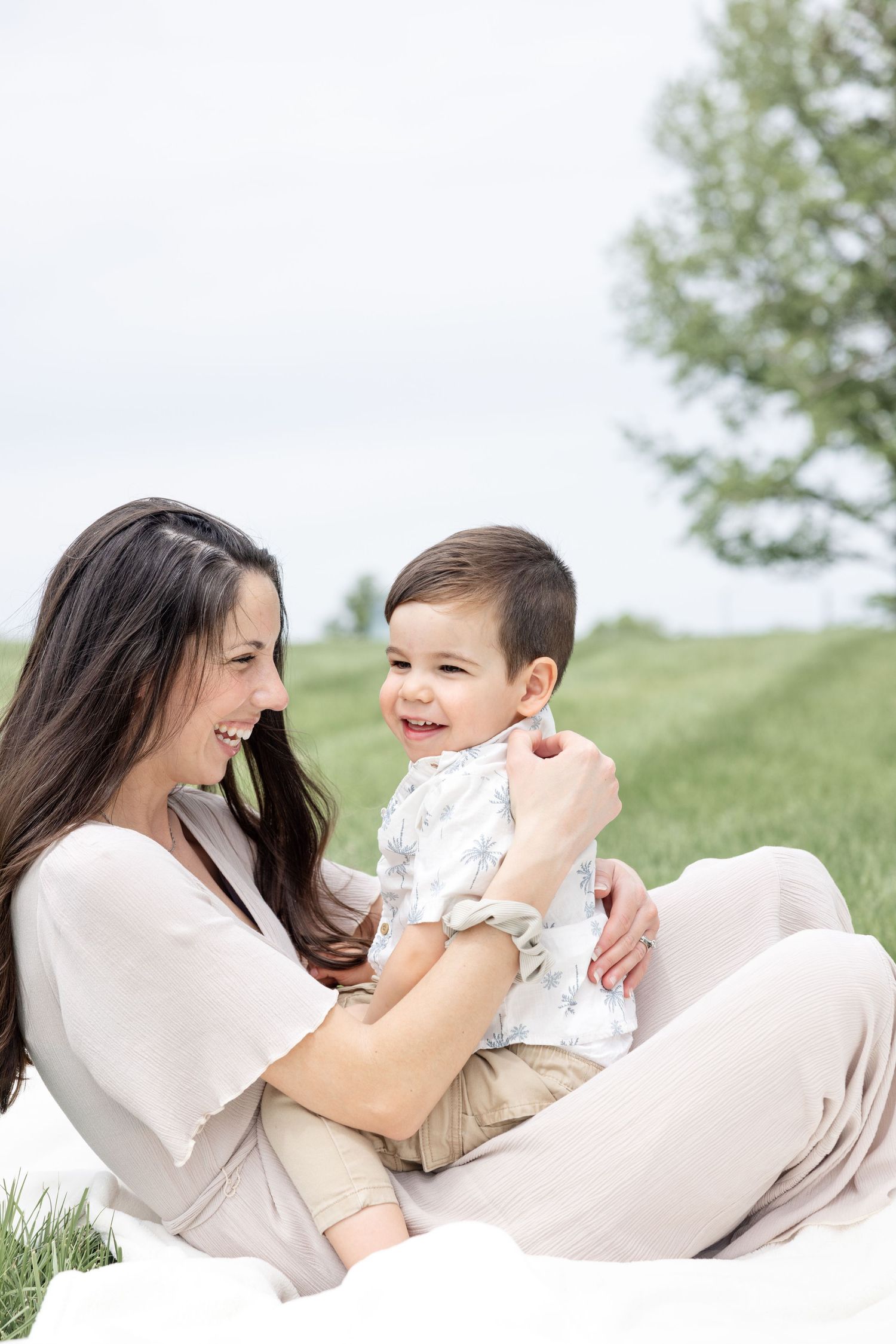 Mother holding her baby during a timeless motherhood session at Carillon Park in Dayton Ohio with Julia and Sean Photography