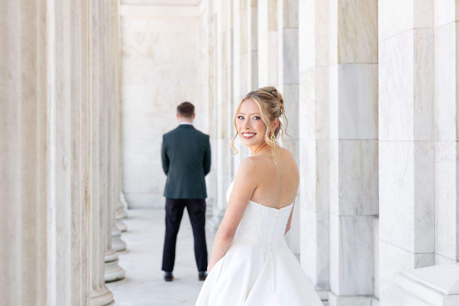 Bride and groom portraits at the Toledo Museum of Art before a Toledo Zoo wedding in Toledo, Ohio photographed by Julia & Sean Photography
