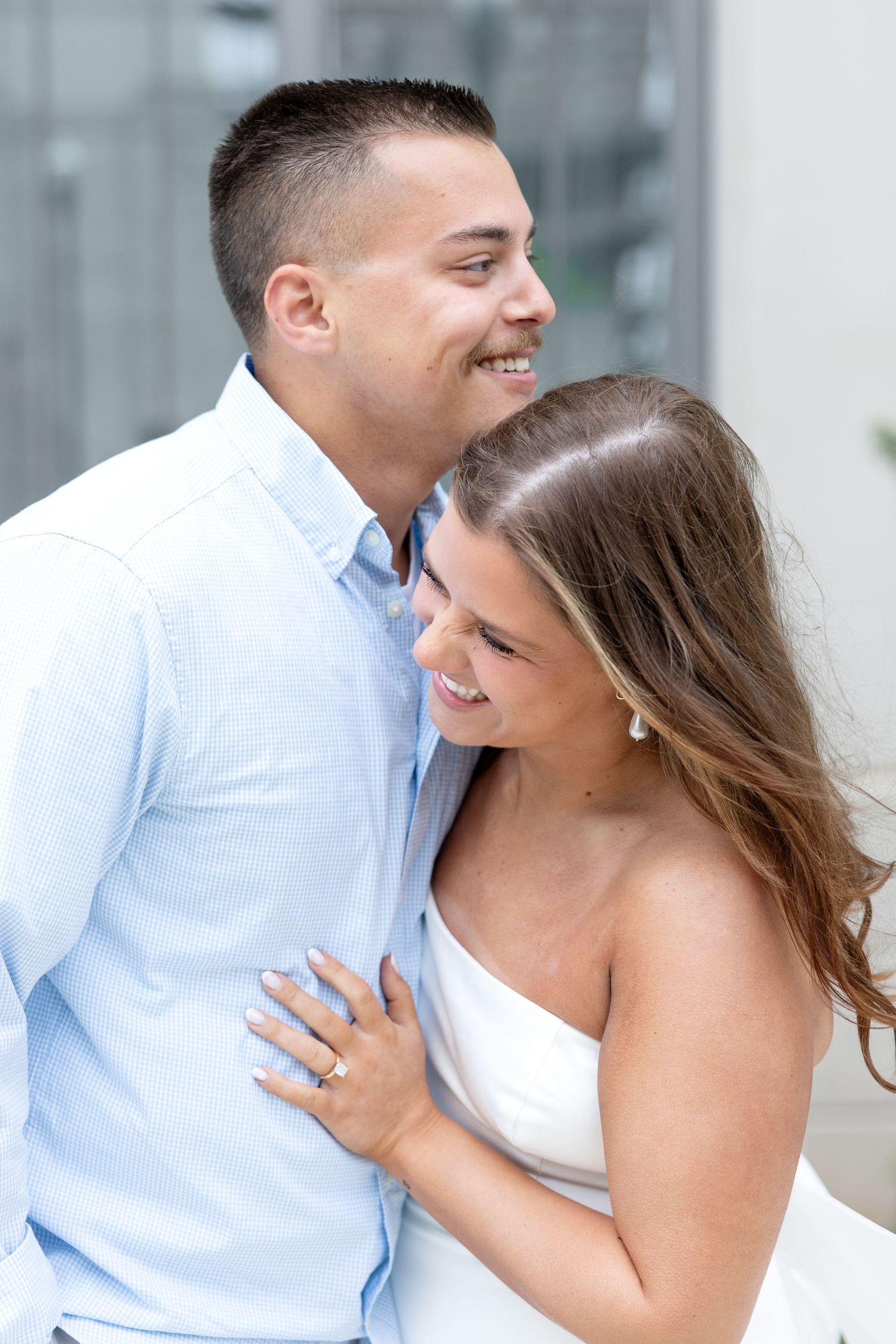 Downtown Huntsville engagement session at First National Bank and Big Spring Park by Julia and Sean Photography, capturing joyful moments.