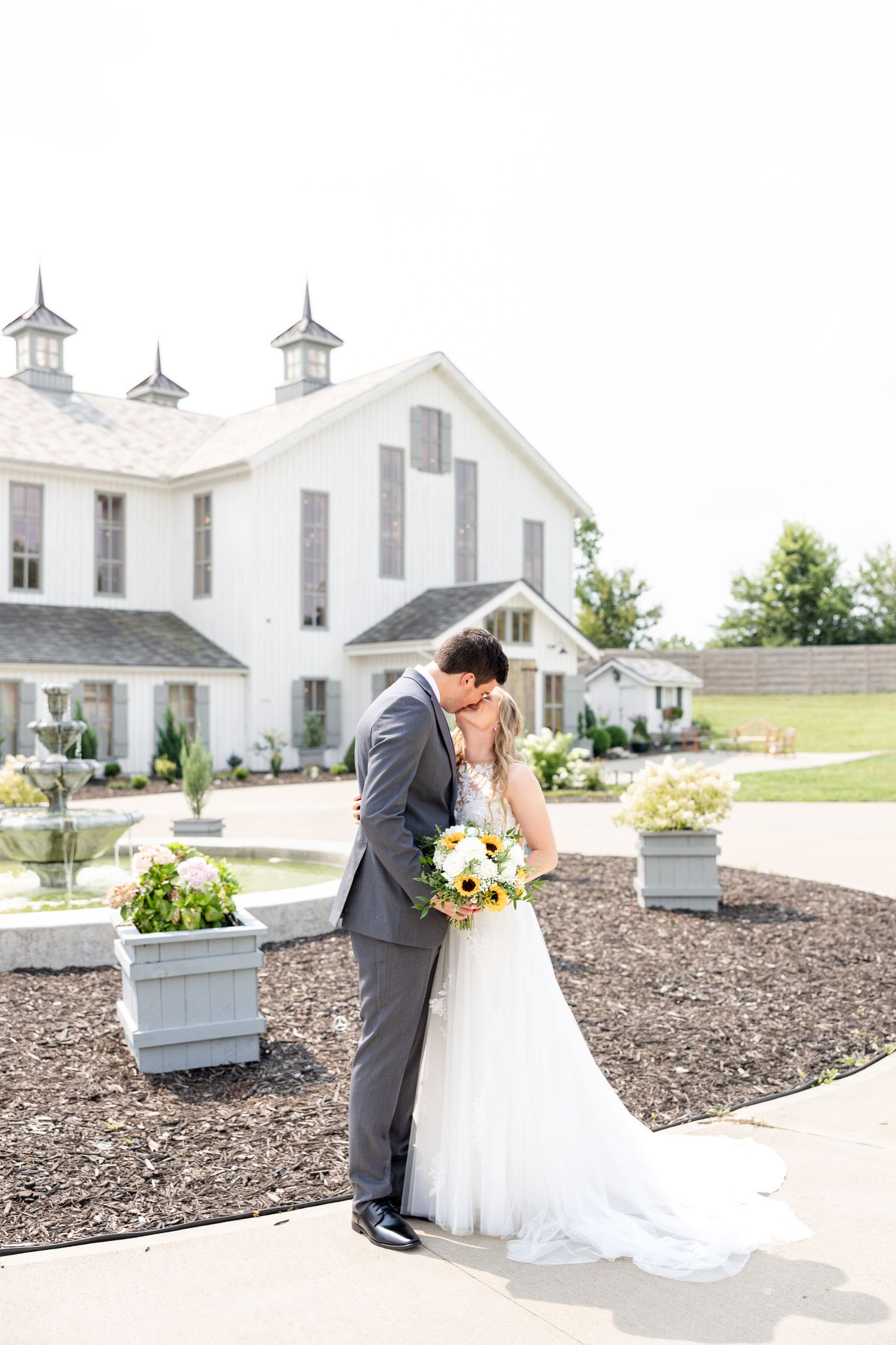 Joyful summer wedding at The Bicentennial Barn in Dayton, Ohio, photographed by Dayton wedding photographers Julia and Sean Photography.
