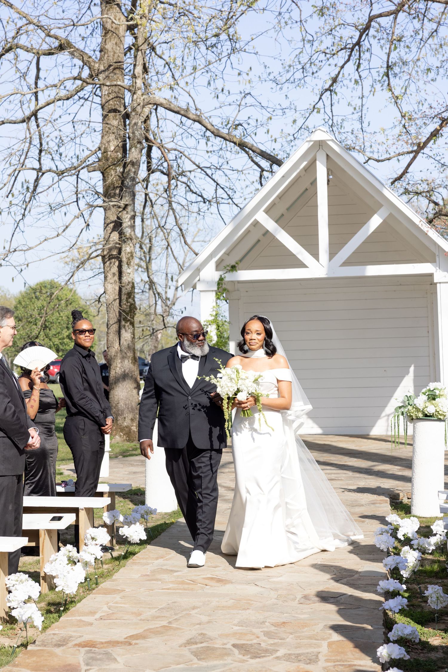 Elegant Glass House wedding near Huntsville, Alabama with natural light, romantic portraits, and faith-filled ceremony moments
