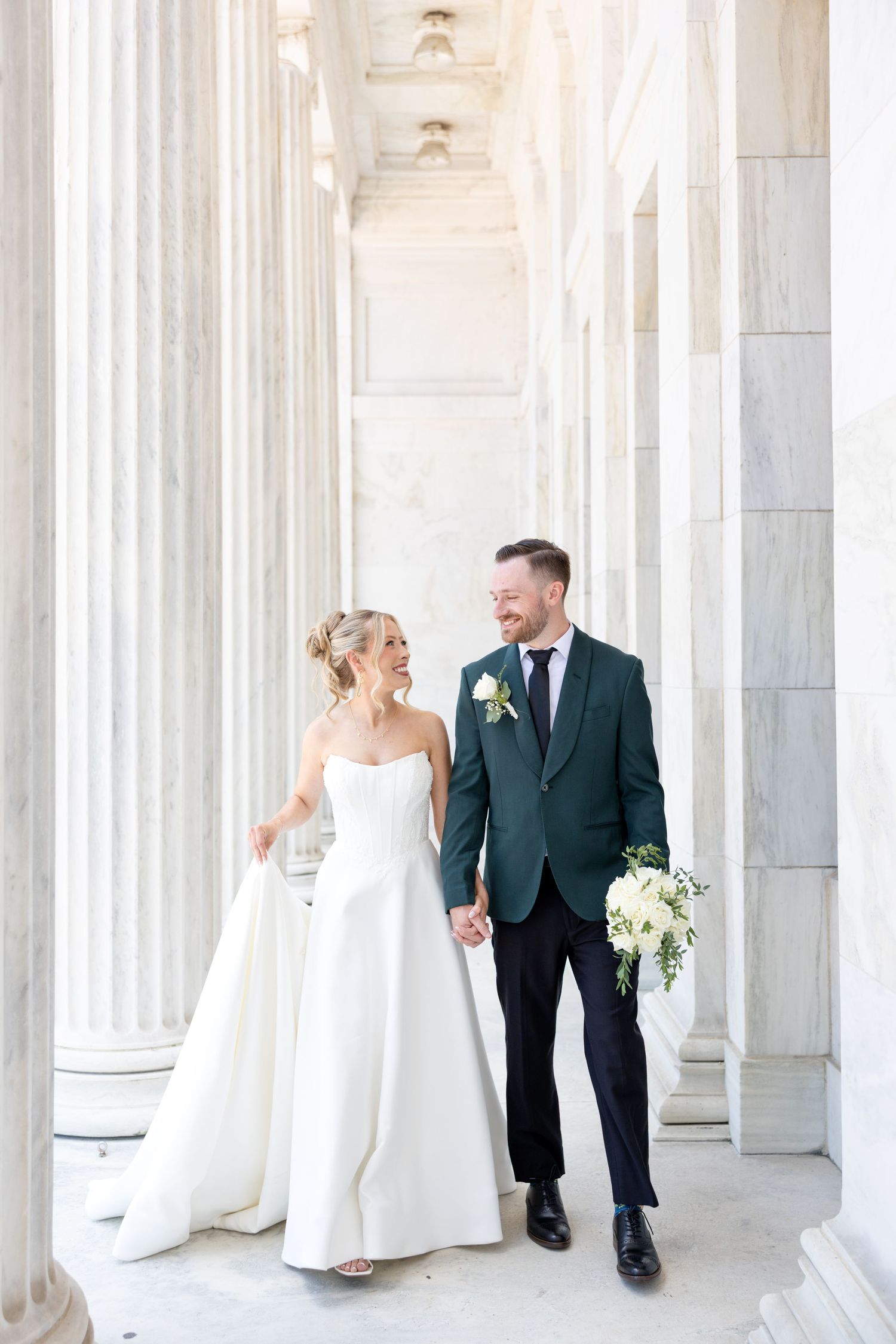 Bride and groom portraits at the Toledo Museum of Art before a Toledo Zoo wedding in Toledo, Ohio photographed by Julia & Sean Photography