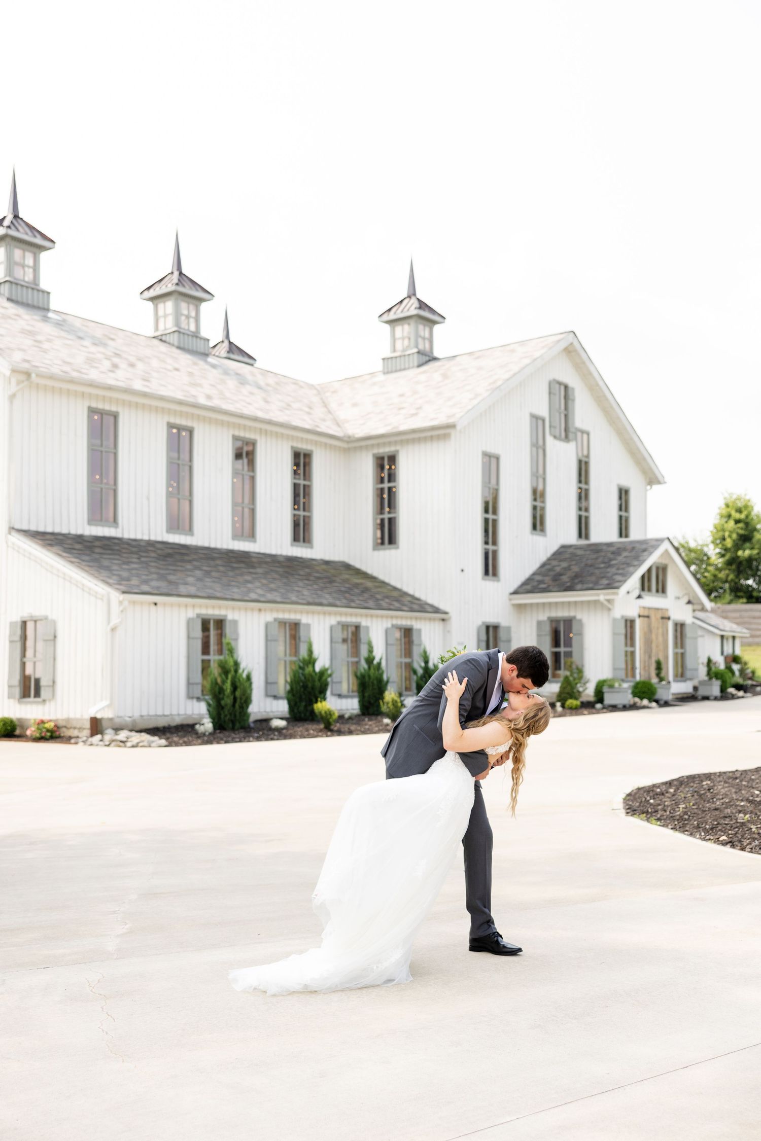 Joyful summer wedding at The Bicentennial Barn in Dayton, Ohio, photographed by Dayton wedding photographers Julia and Sean Photography.