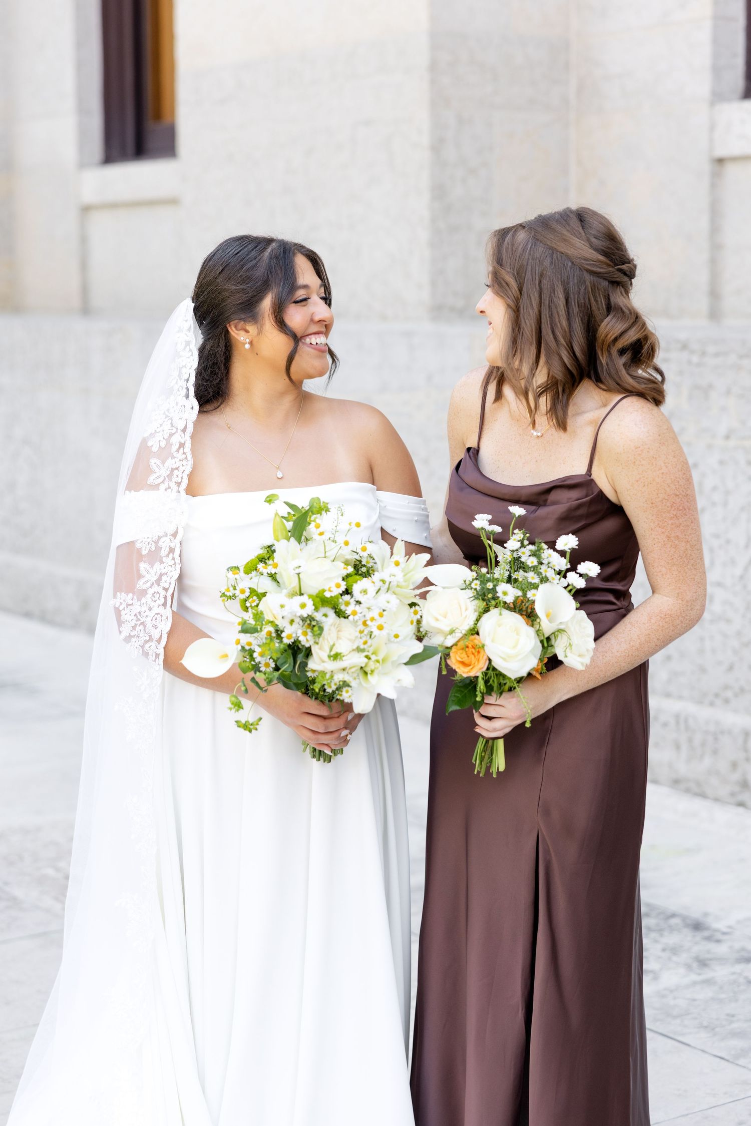 Bride and groom celebrating their Flat 51 wedding in downtown Columbus, Ohio, captured with timeless, light and airy wedding photography.
