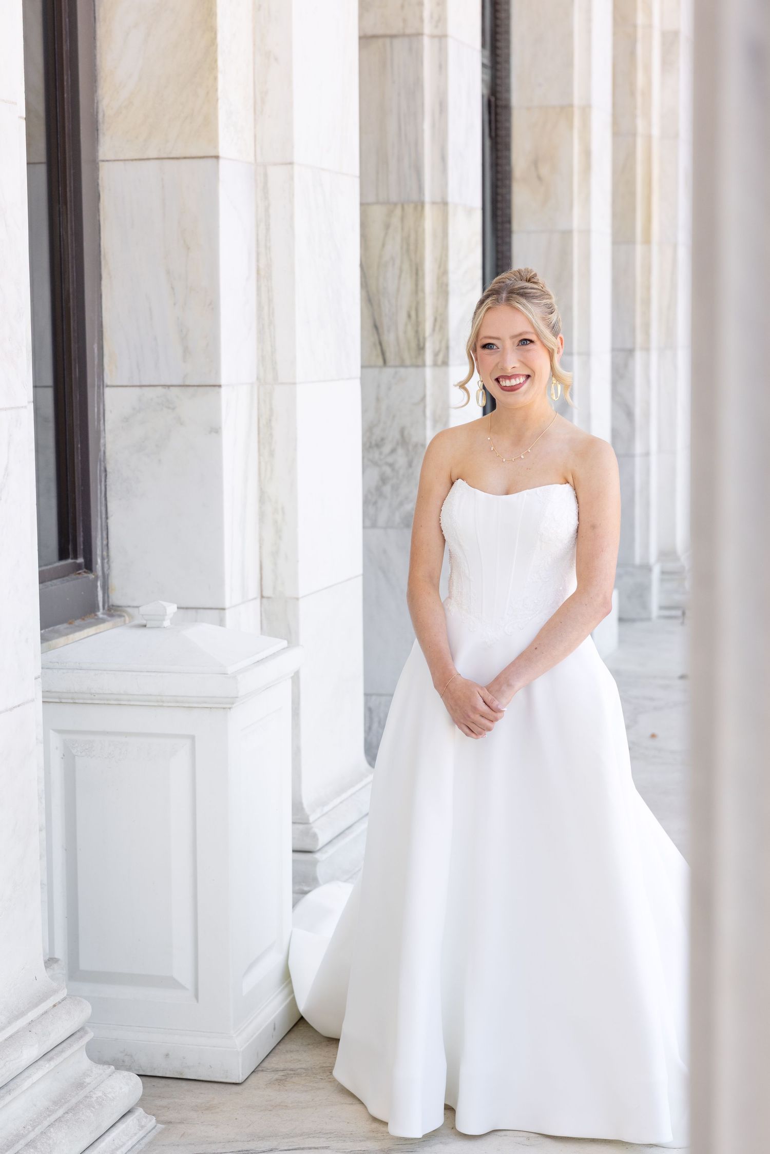 Bride and groom portraits at the Toledo Museum of Art before a Toledo Zoo wedding in Toledo, Ohio photographed by Julia & Sean Photography