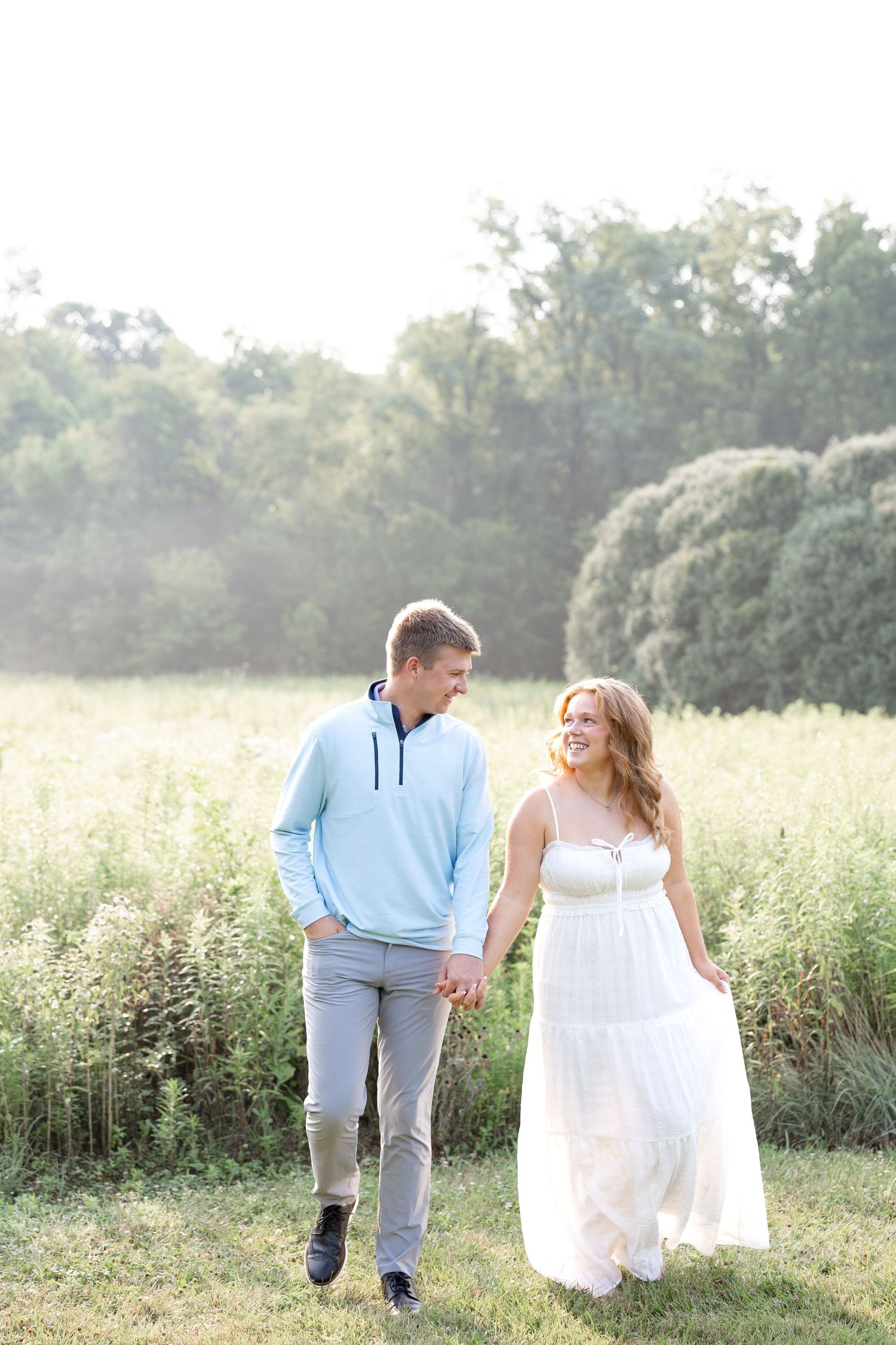 Wegerzyn Gardens engagement session in Dayton, Ohio featuring a joyful couple enjoying soft morning light and timeless engagement photos.