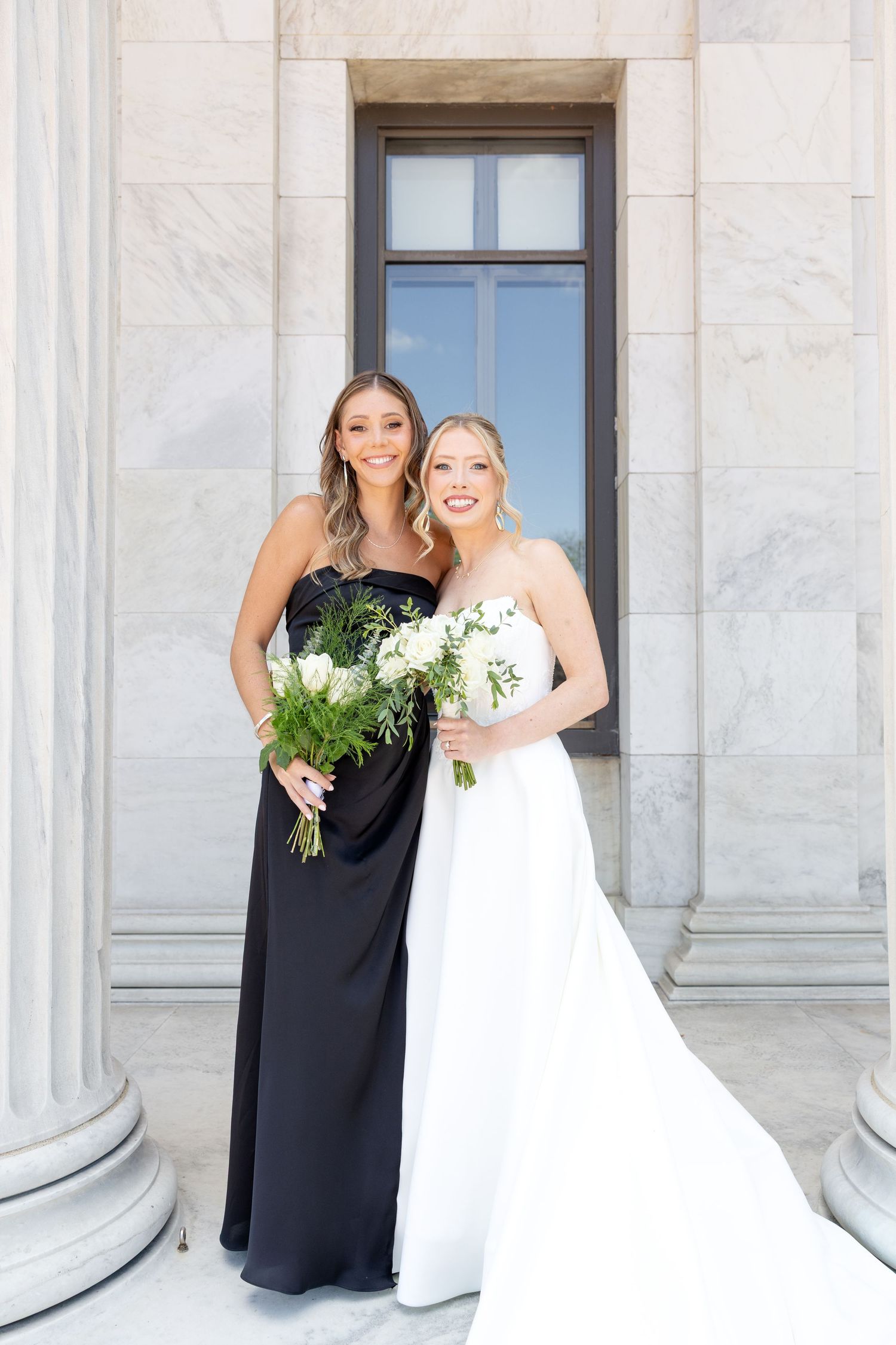 Bride and groom portraits at the Toledo Museum of Art before a Toledo Zoo wedding in Toledo, Ohio photographed by Julia & Sean Photography
