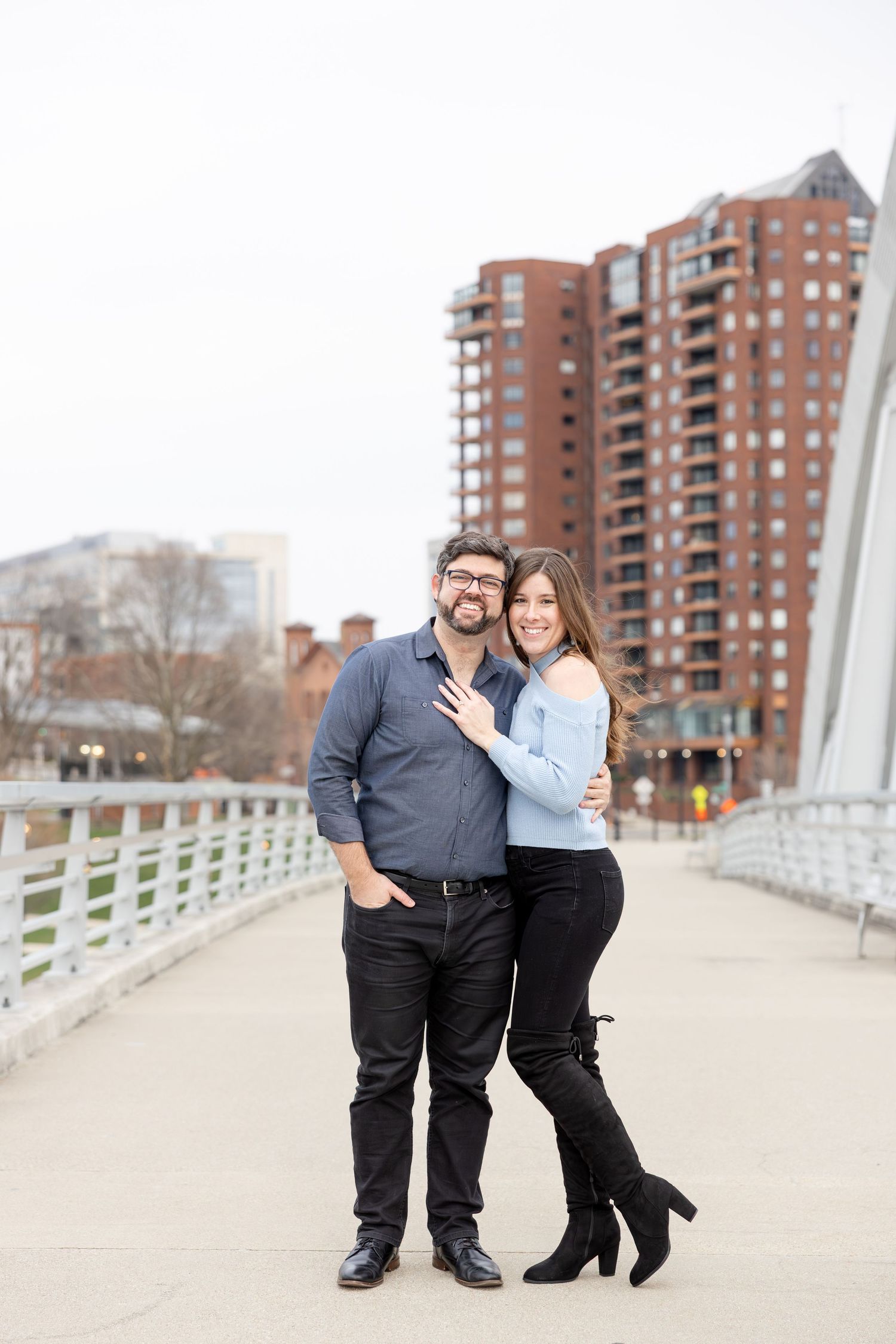 Downtown Columbus engagement photos on Main Street Bridge with a joyful couple in a light and airy style
